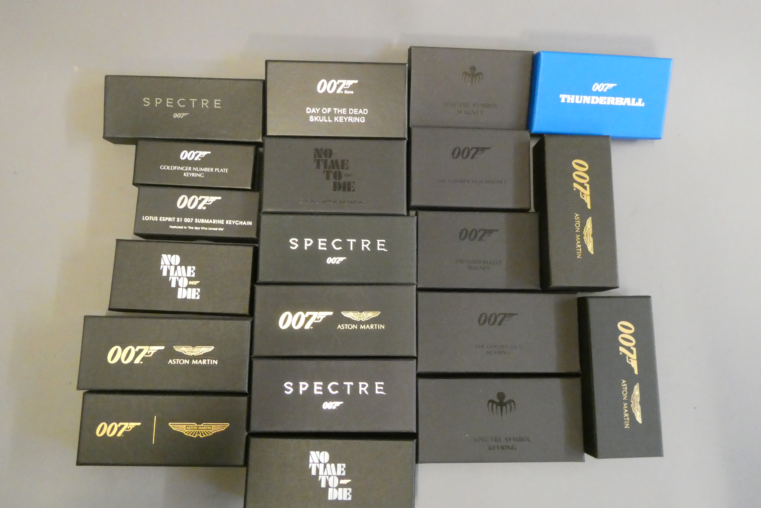 Twenty James Bond themed key rings and magnet including Aston Martin, Lotus and Jaguar, all items Image