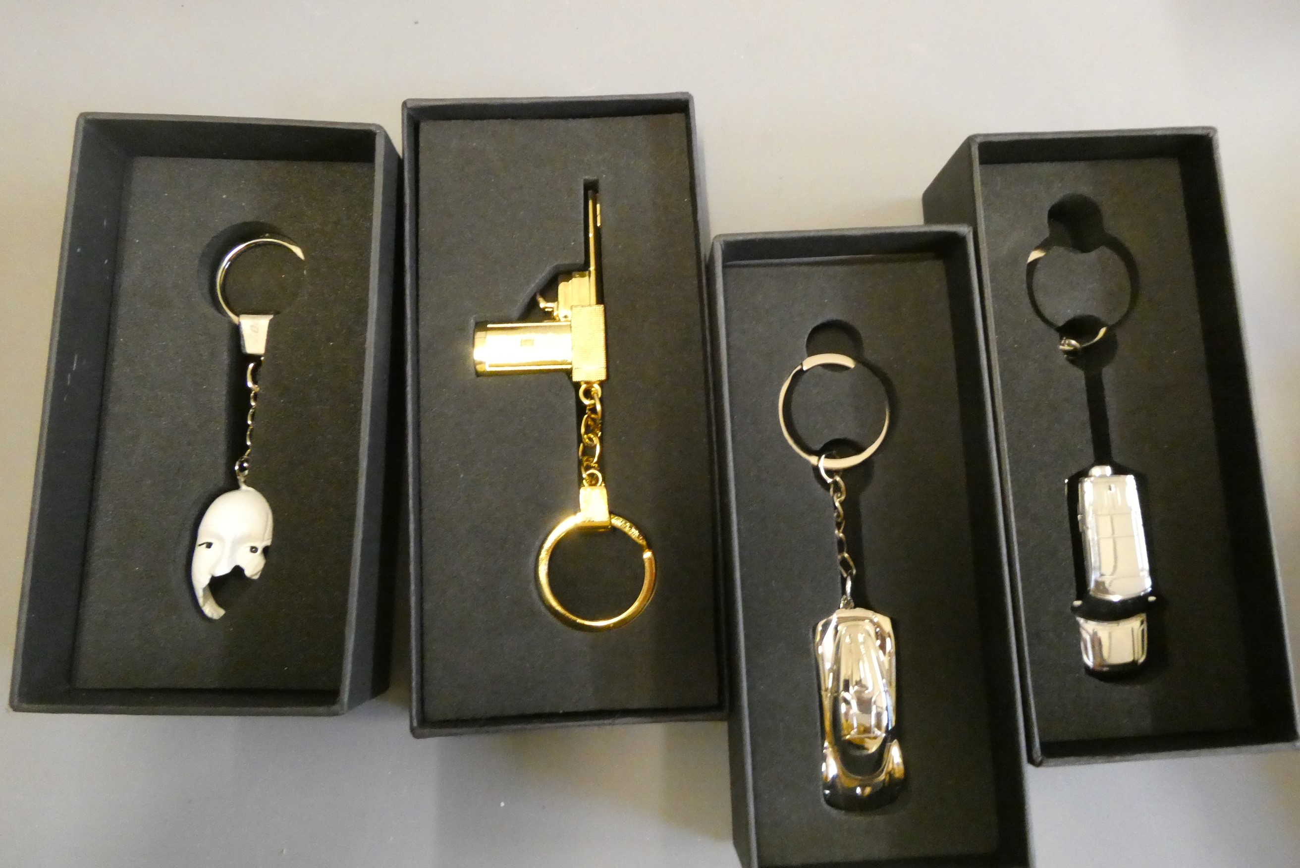 Twenty James Bond themed key rings and magnet including Aston Martin, Lotus and Jaguar, all items Image