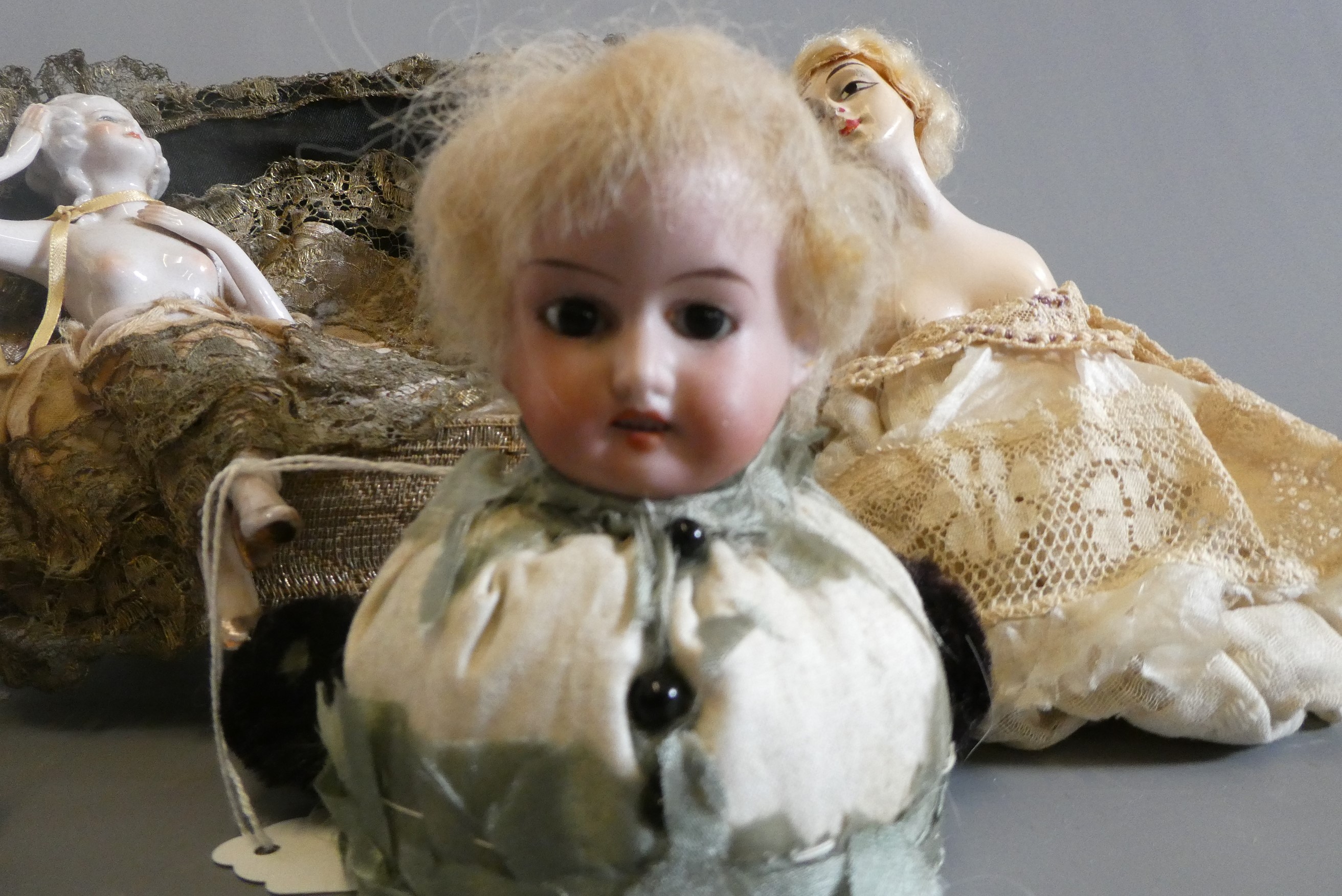 Four pin cushion and two fashion dolls Image