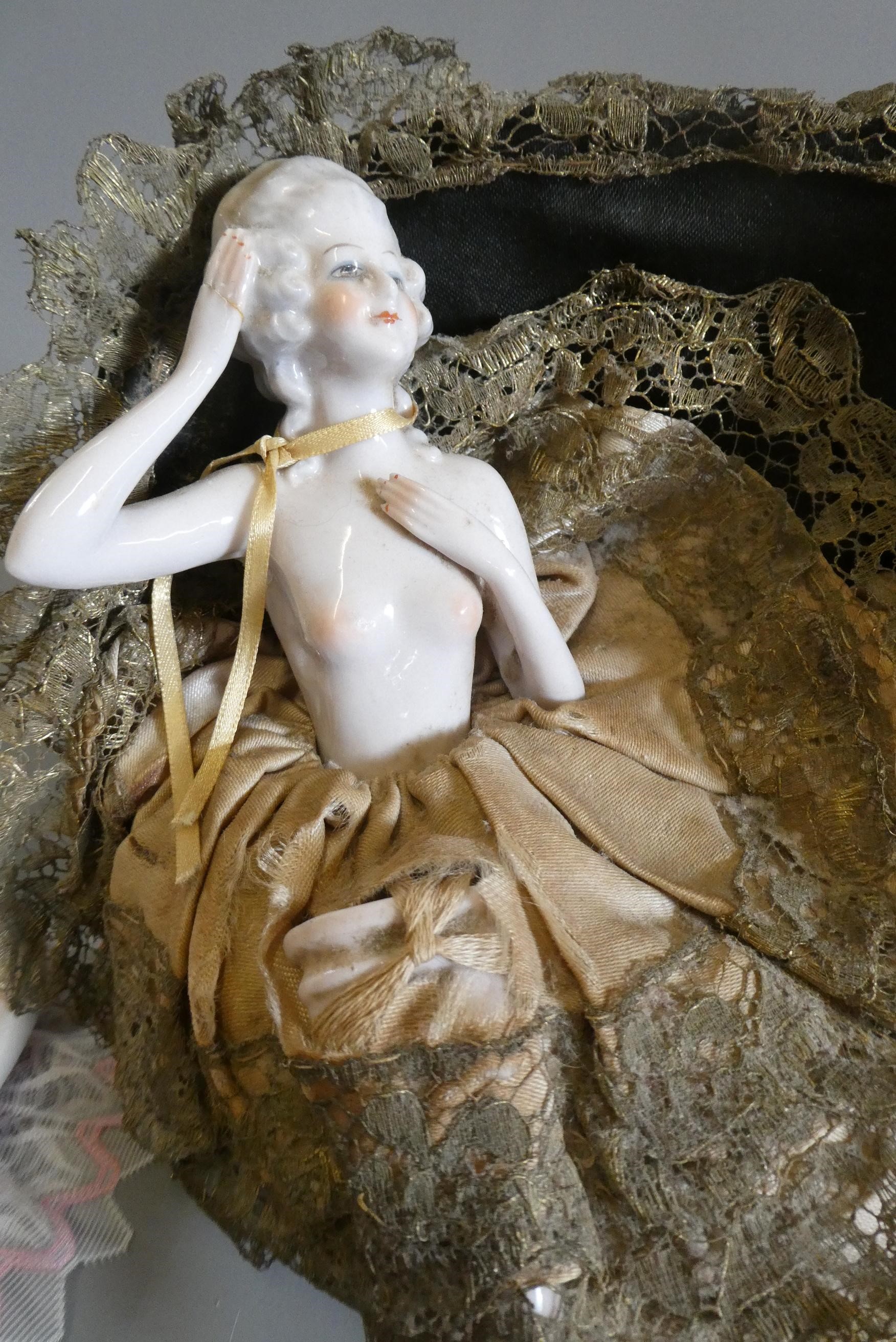 Four pin cushion and two fashion dolls Image