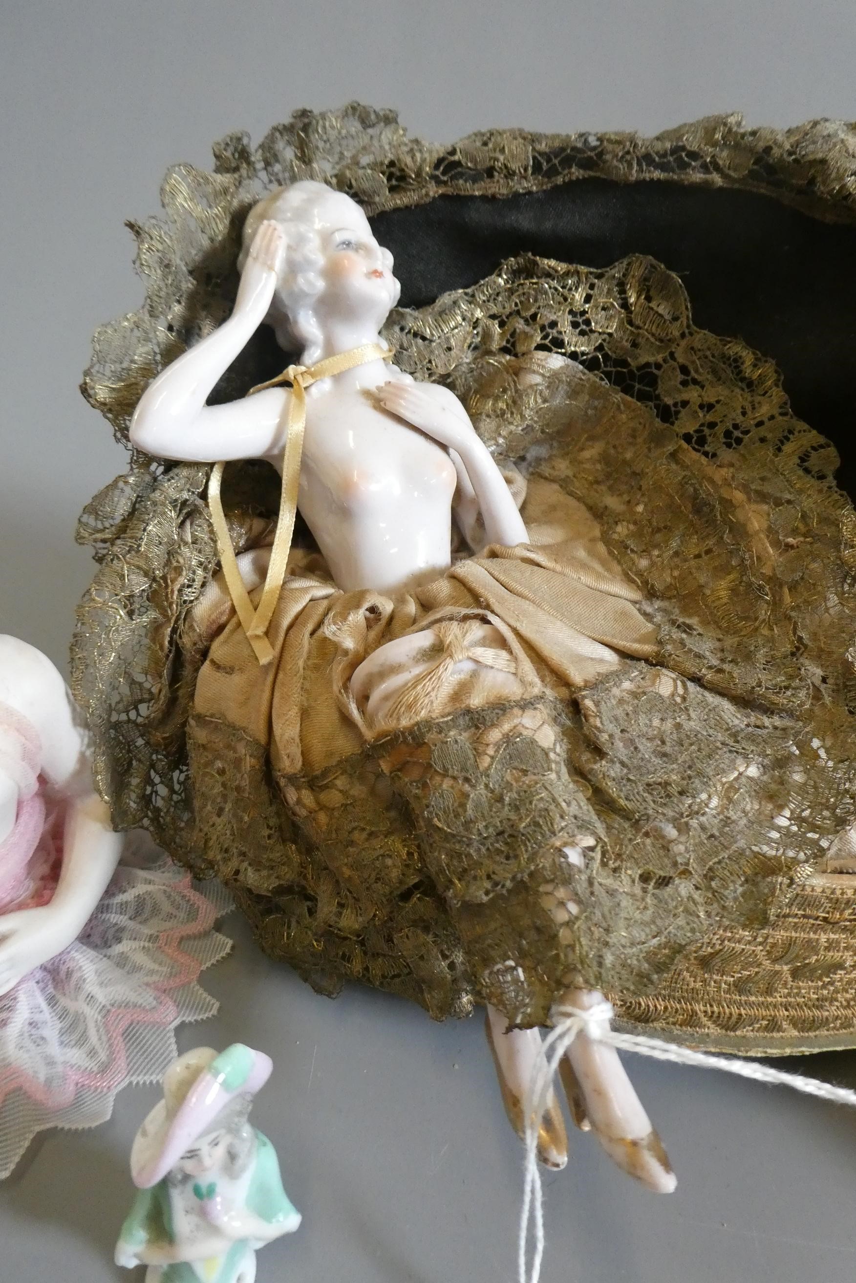 Four pin cushion and two fashion dolls Image