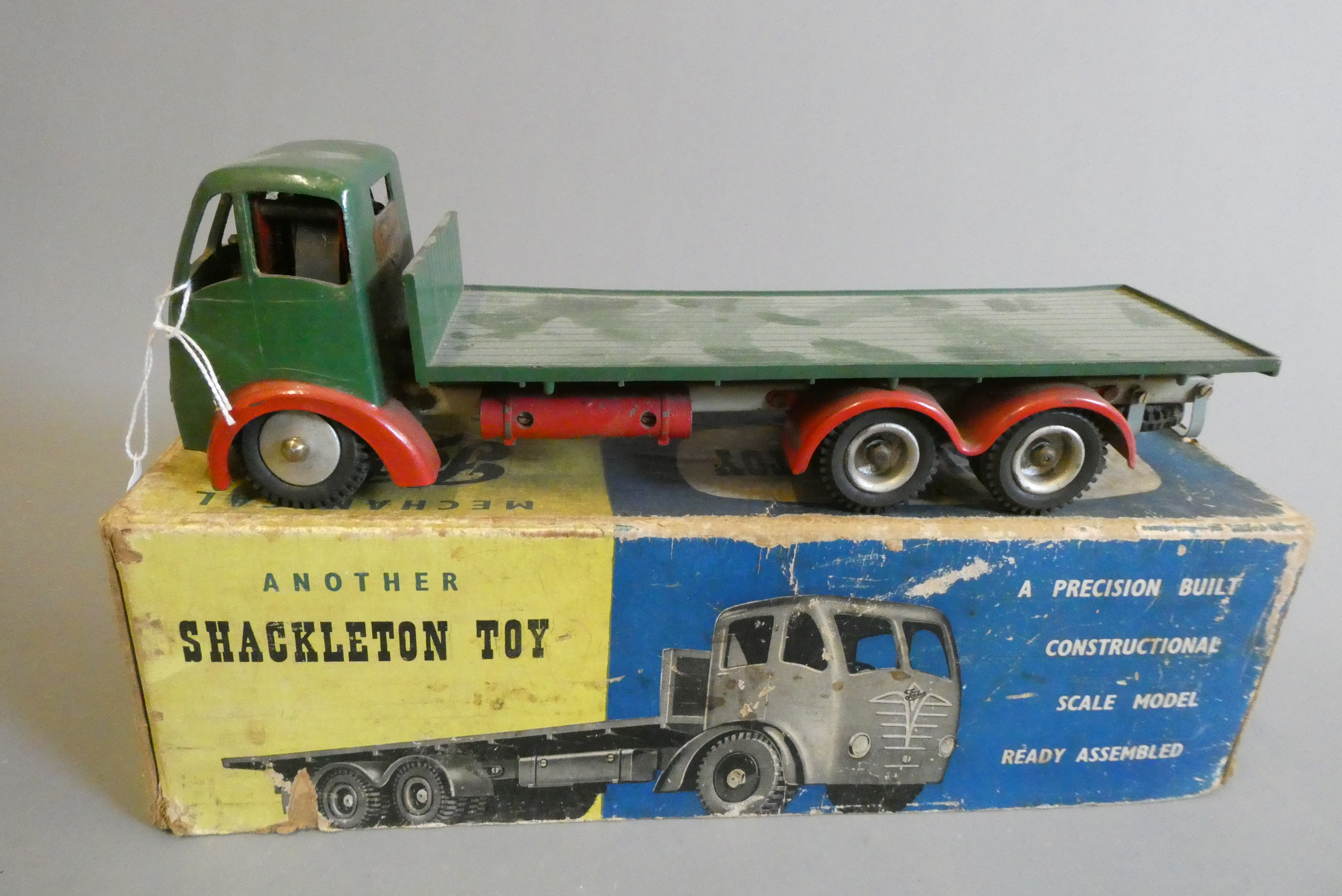 Shackleton clockwork Foden flatbed lorry finished in green, clockwork motor faulty, some damage to Image
