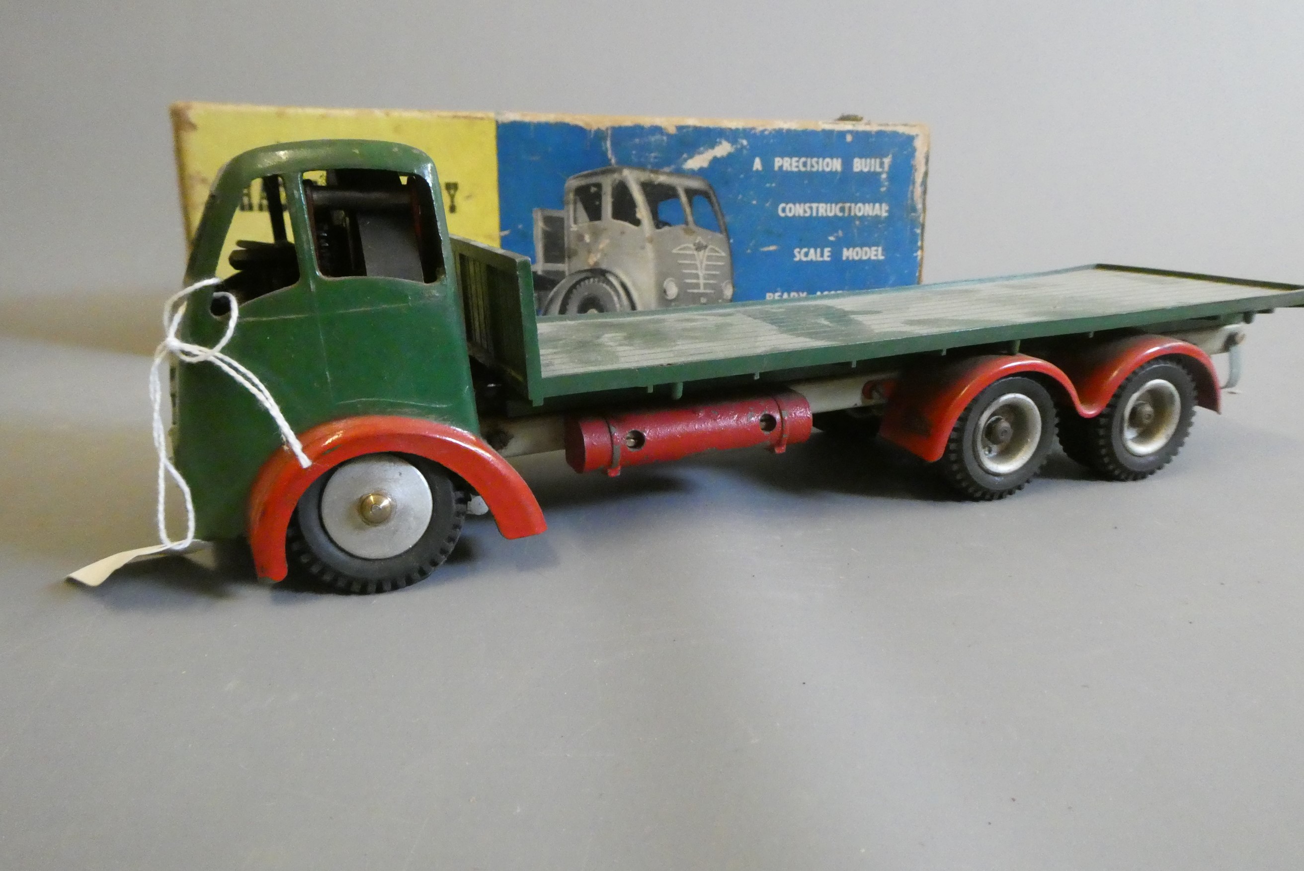 Shackleton clockwork Foden flatbed lorry finished in green, clockwork motor faulty, some damage to Image