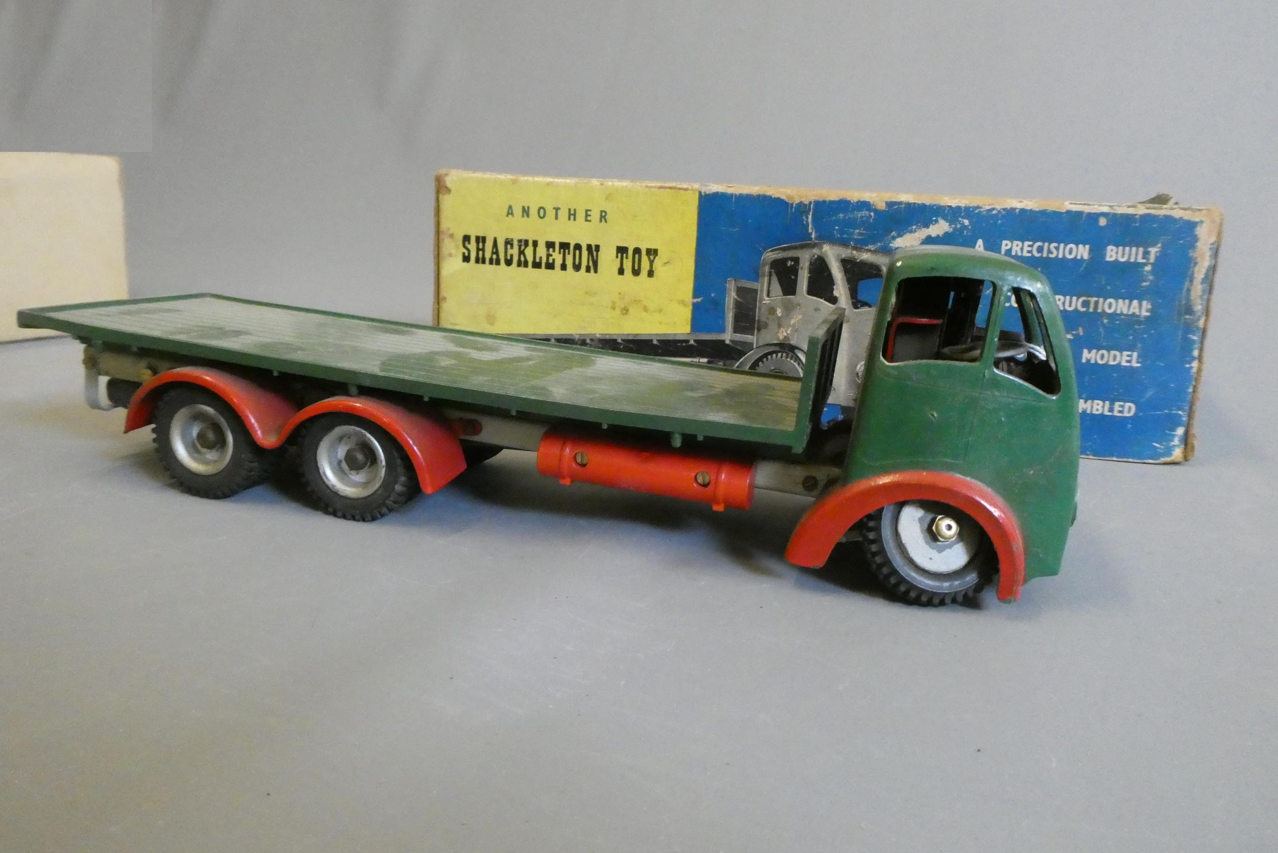 Shackleton clockwork Foden flatbed lorry finished in green, clockwork motor faulty, some damage to Image
