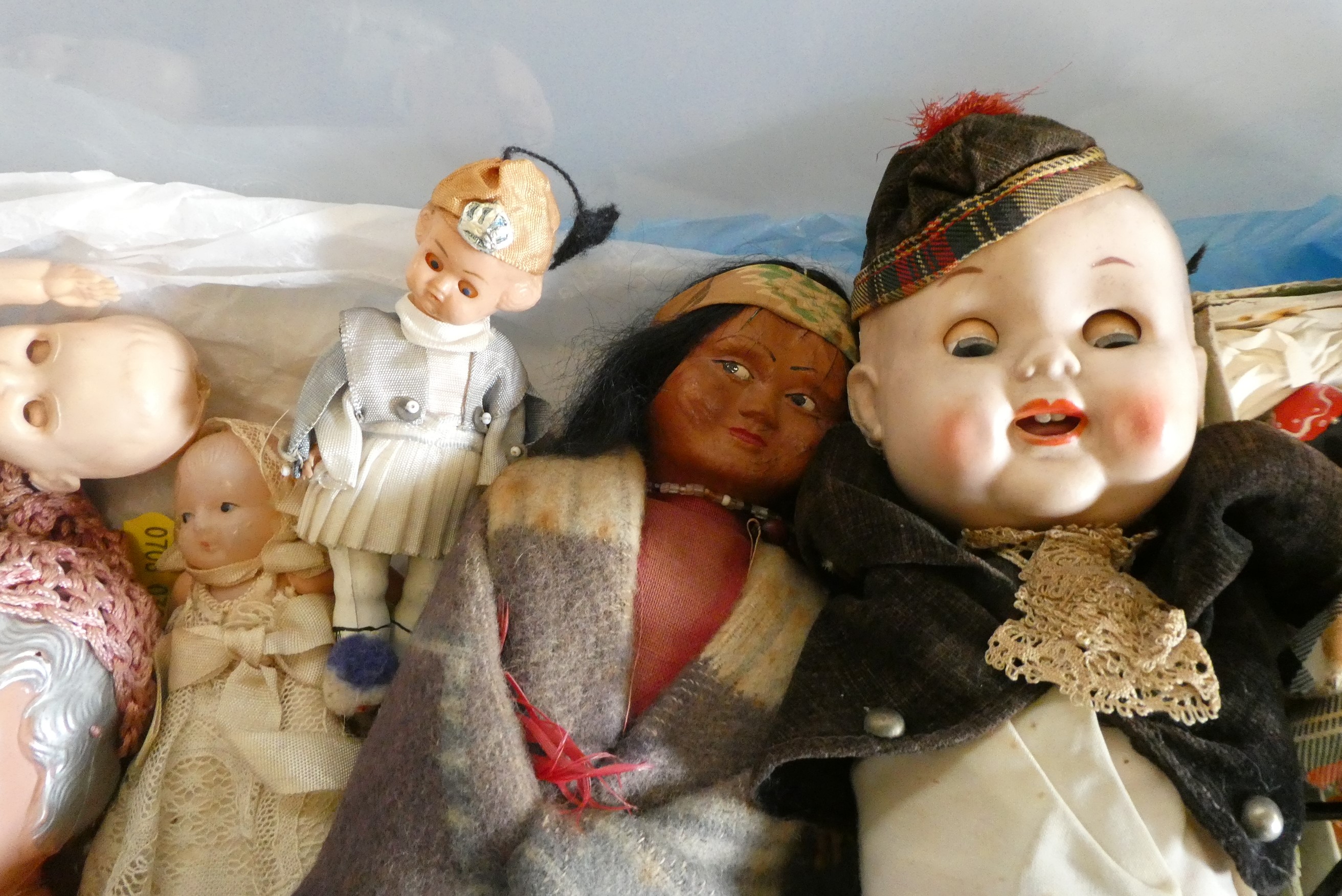 A box of vintage doll's including celluloid, bisque and composition examples (Est. plus 24% buyer's Image
