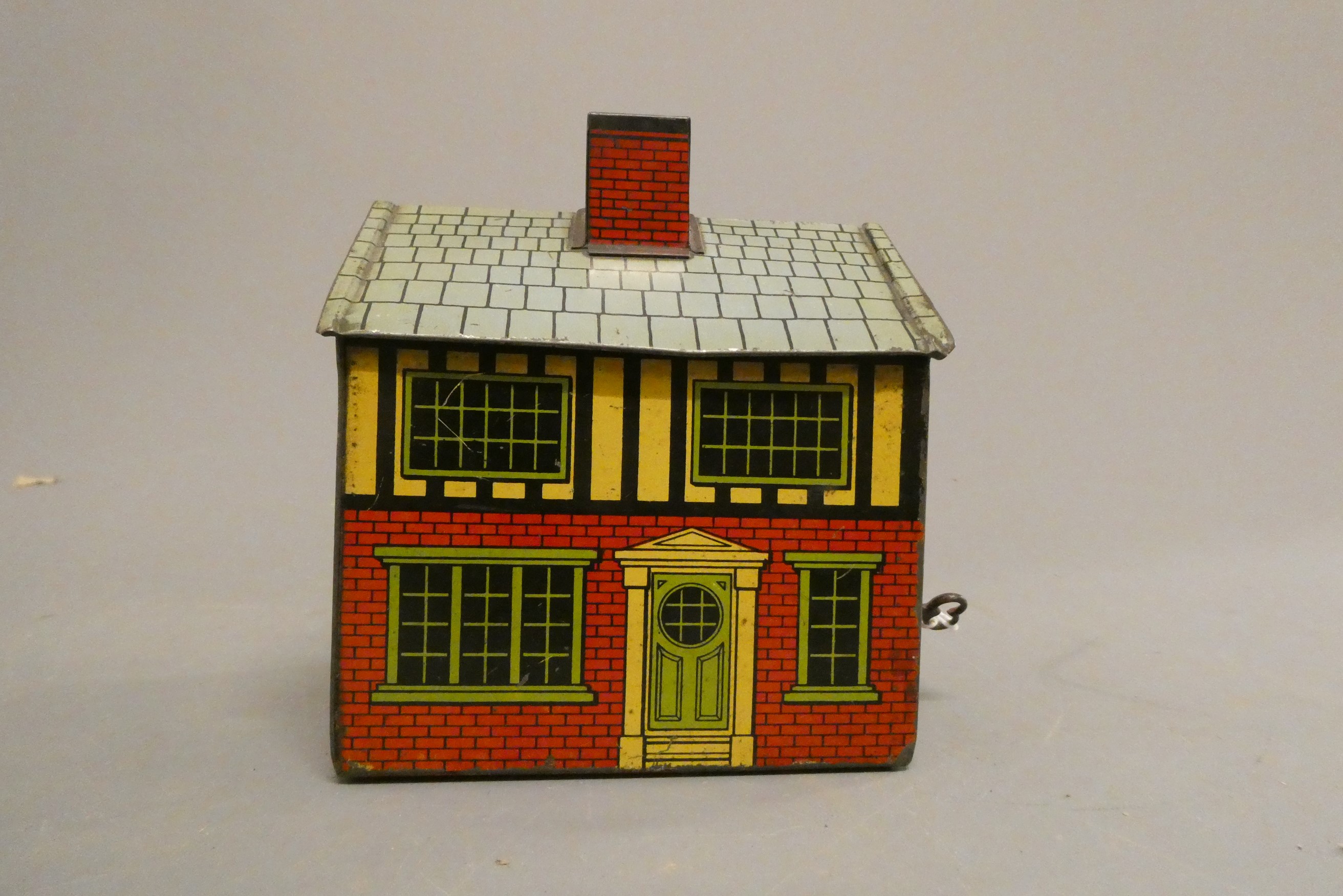 Printed tinplate money box from Dellona Cream Caramels complete with key to give access through one Image