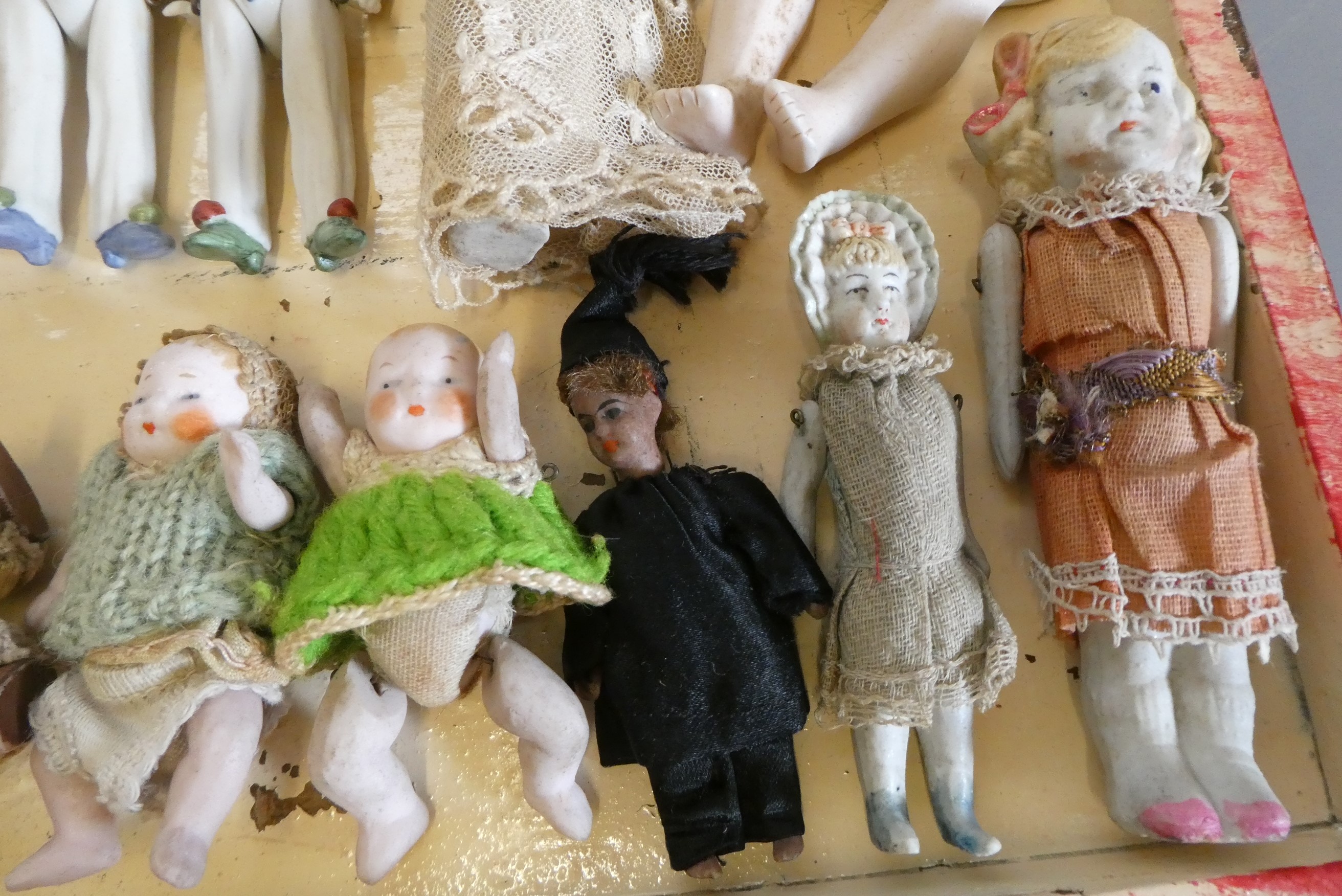A chest of doll's house and miniature dolls and models, mainly bisque, including three jointed Image