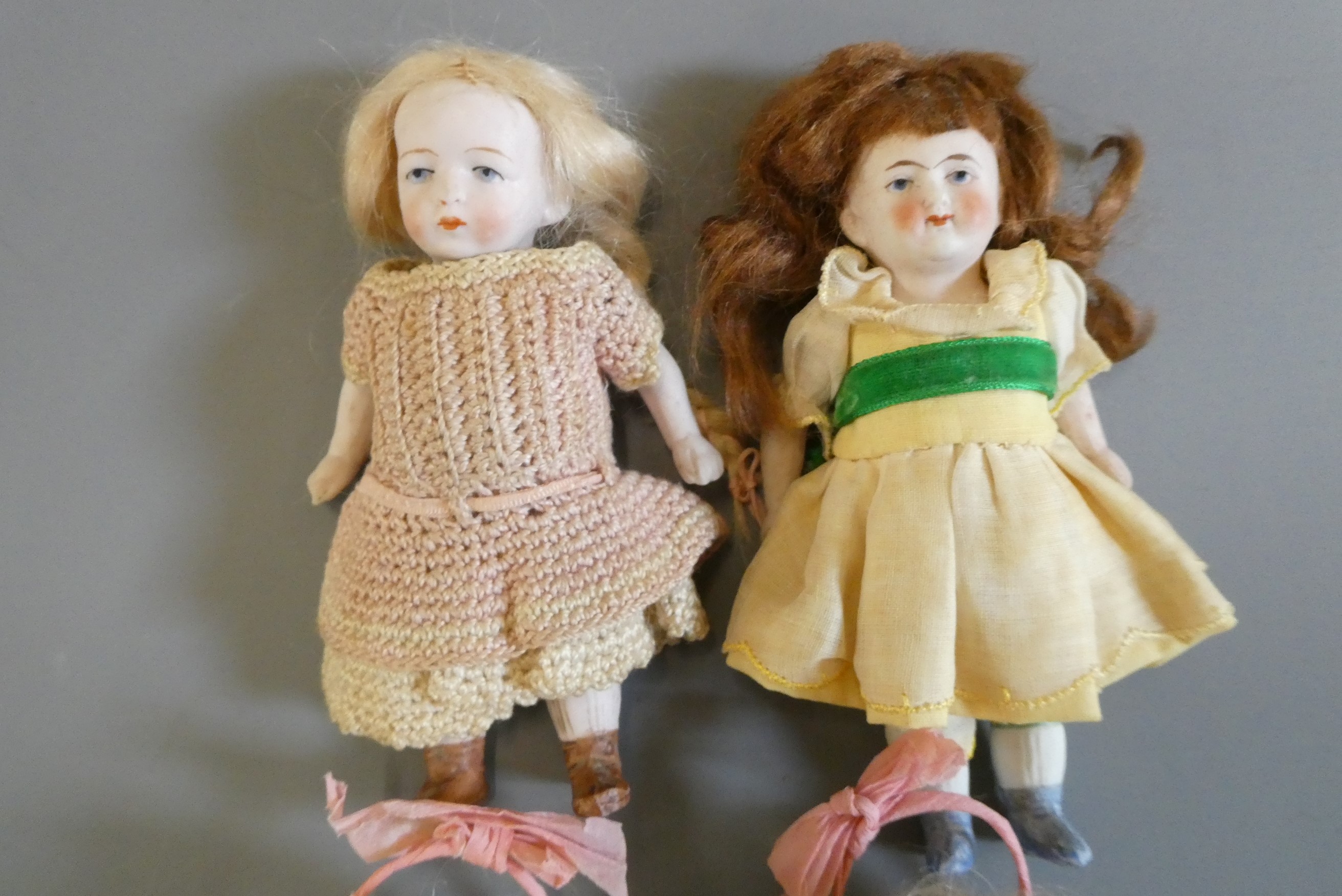 Four all bisque doll's house dolls all with jointed shoulders and hips Image