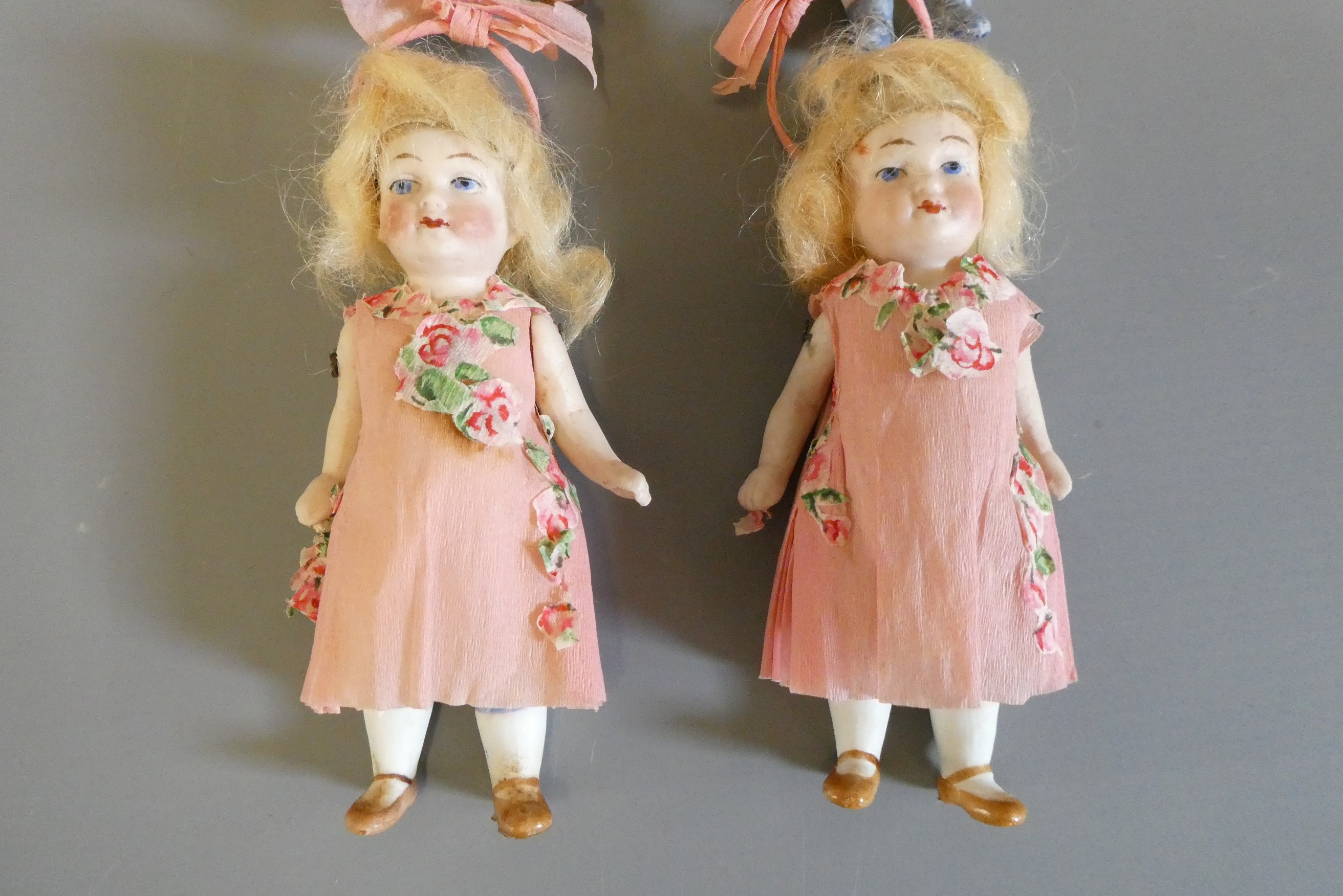 Four all bisque doll's house dolls all with jointed shoulders and hips Image