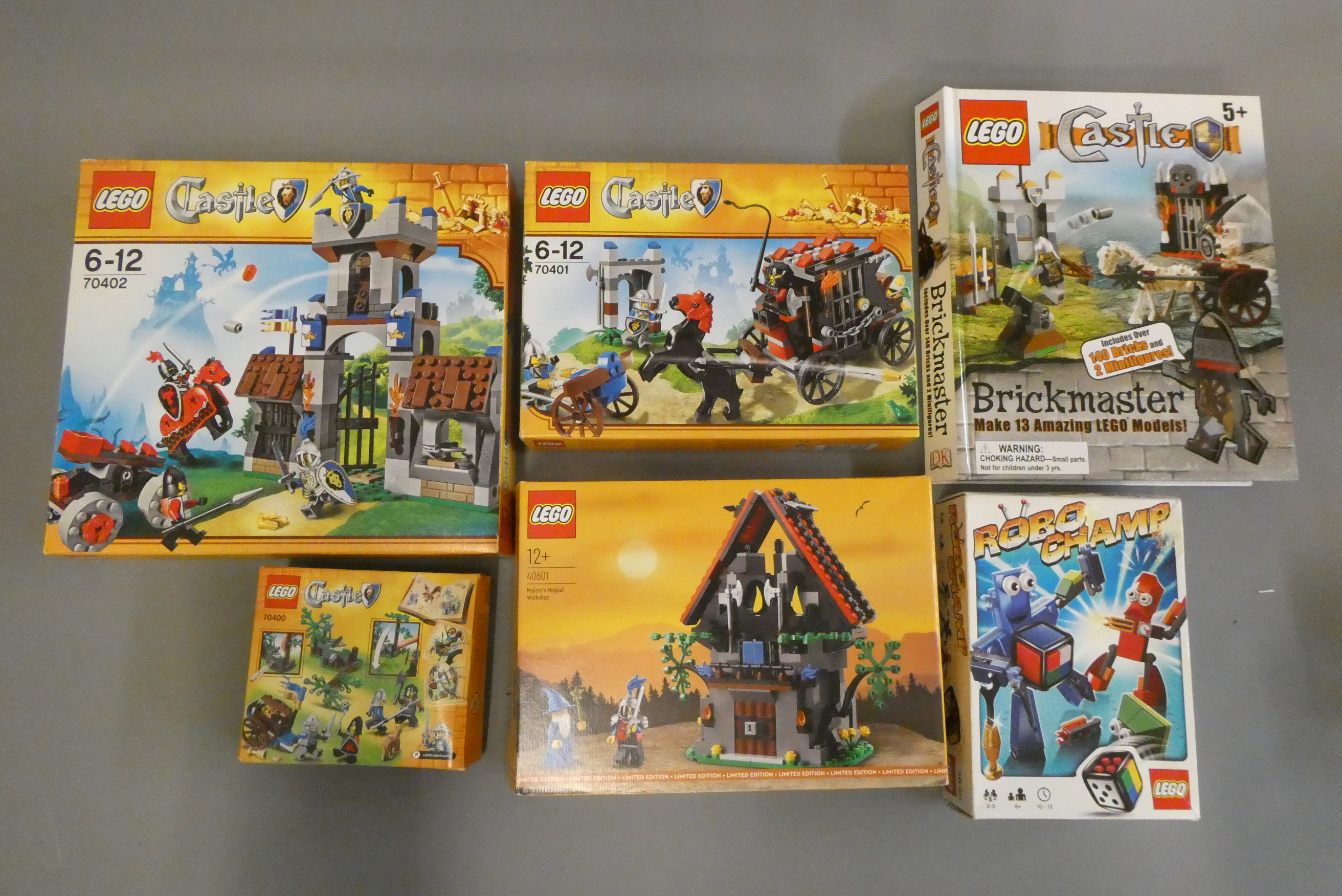 Five boxed Lego sets including Castle 3835/40601/70400/70401/70402 and a Brickmaster book set. Most Image