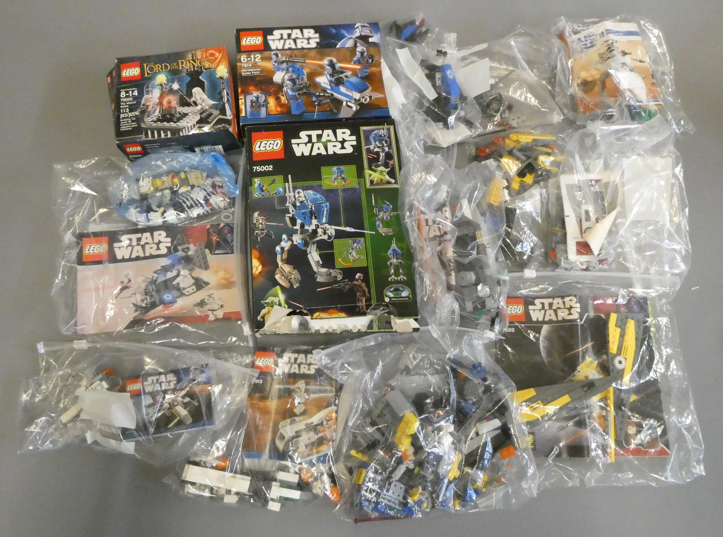 A quantity of boxed and loose Star Wars Lego including 75002 and 7914 boxed Image