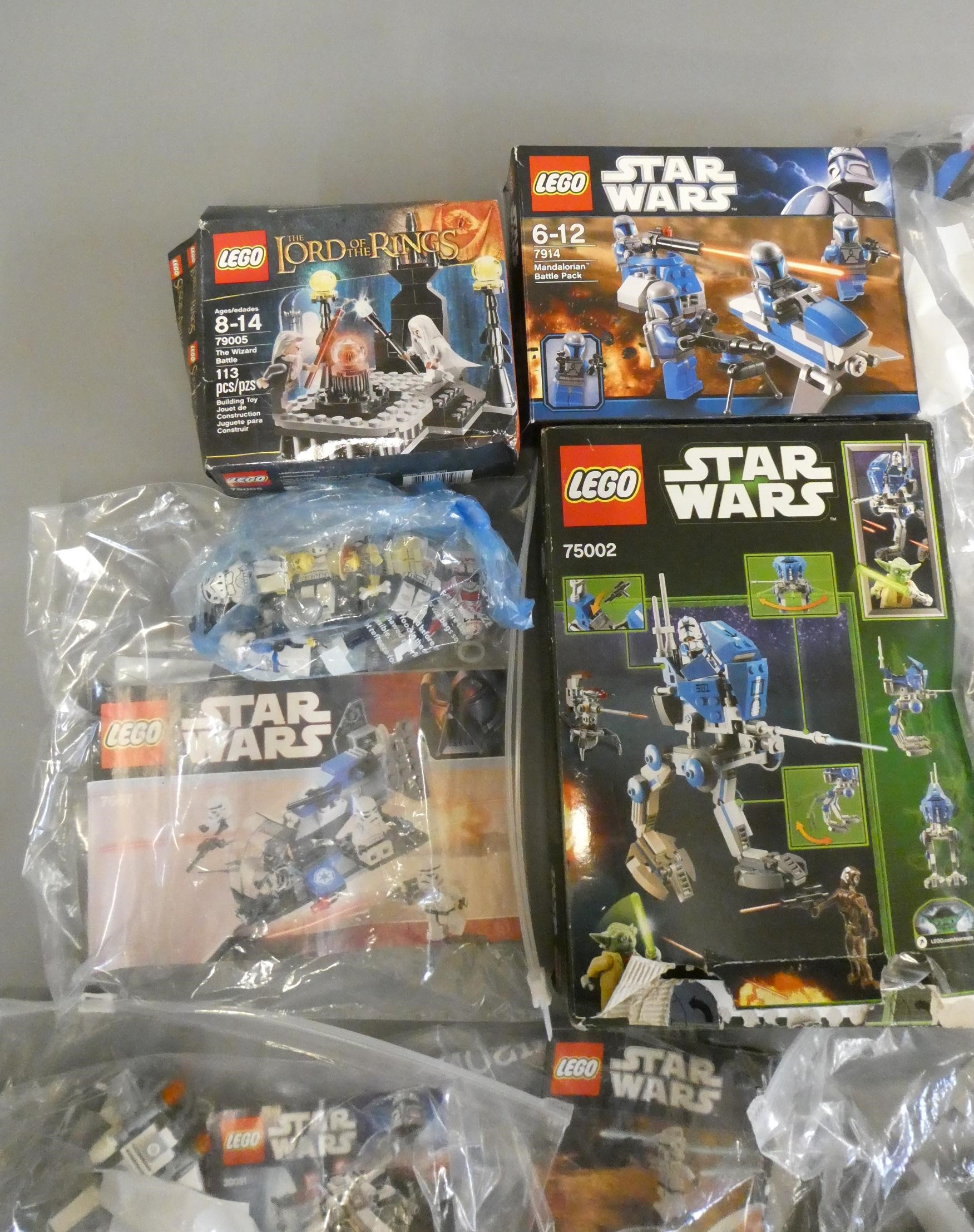 A quantity of boxed and loose Star Wars Lego including 75002 and 7914 boxed Image