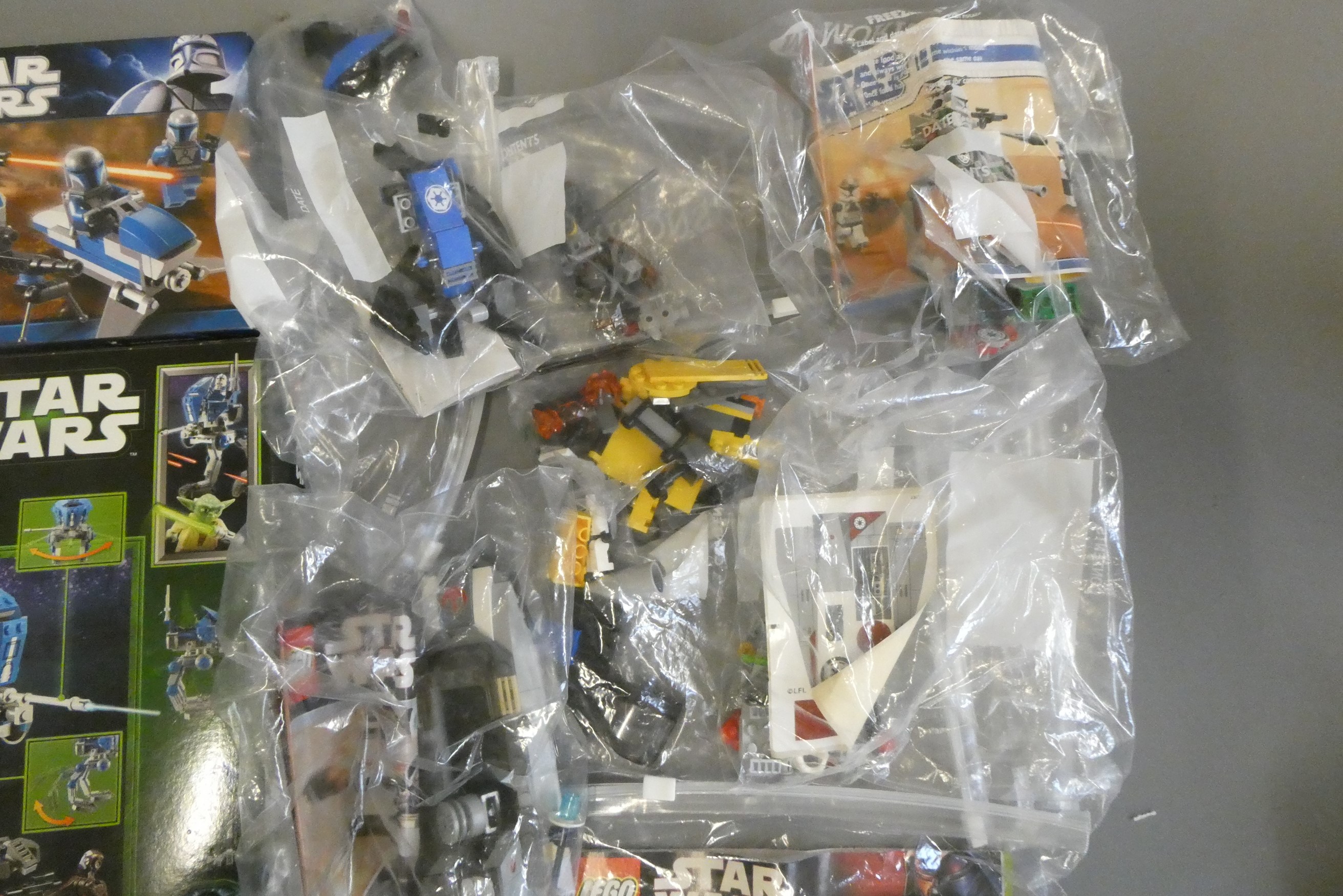 A quantity of boxed and loose Star Wars Lego including 75002 and 7914 boxed Image