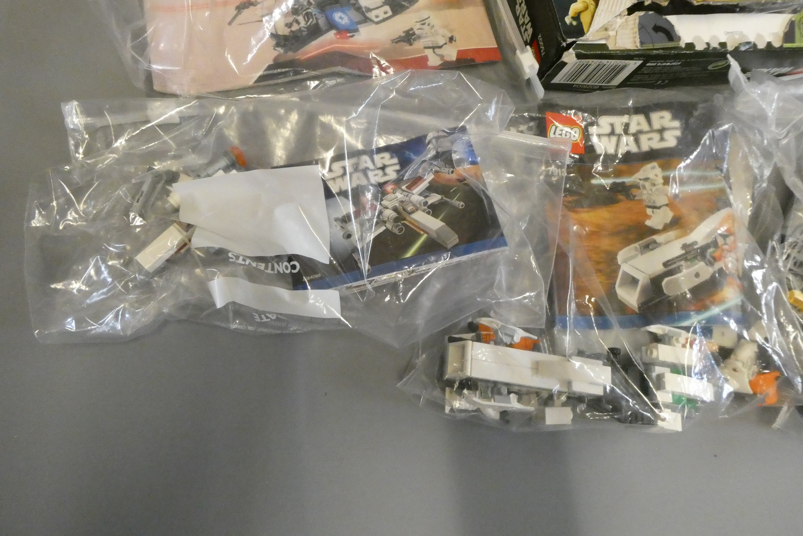 A quantity of boxed and loose Star Wars Lego including 75002 and 7914 boxed Image