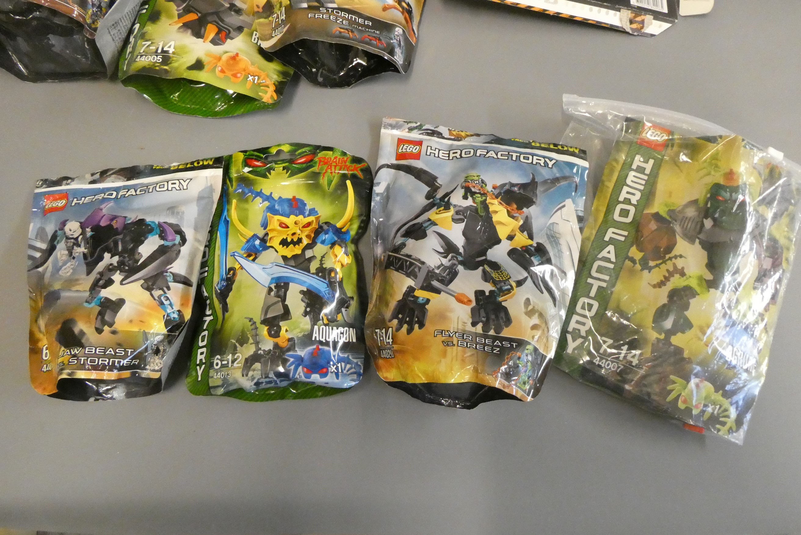 A collection of 10x Lego Hero Factory 'Brain Attack' and 'Invasion from Below' bagged characters to Image