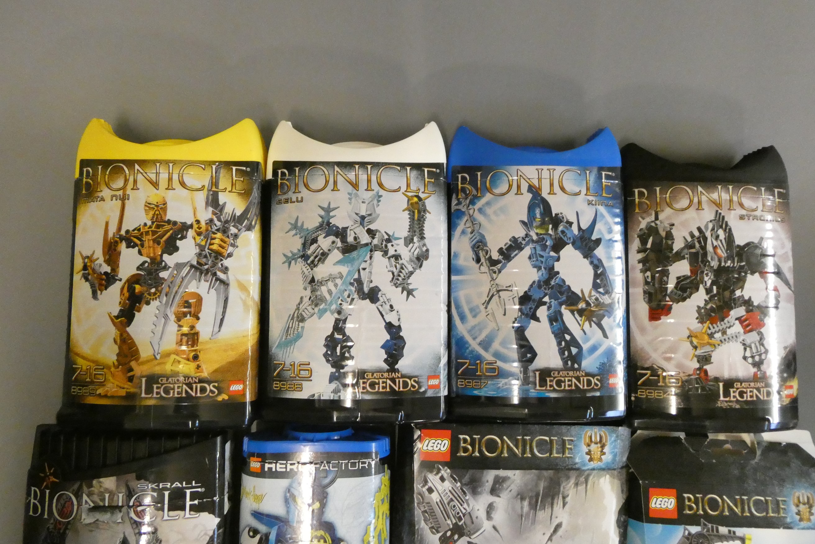A collection of 12x boxed Lego Bionicle sets including Glatorian Legends examples Image