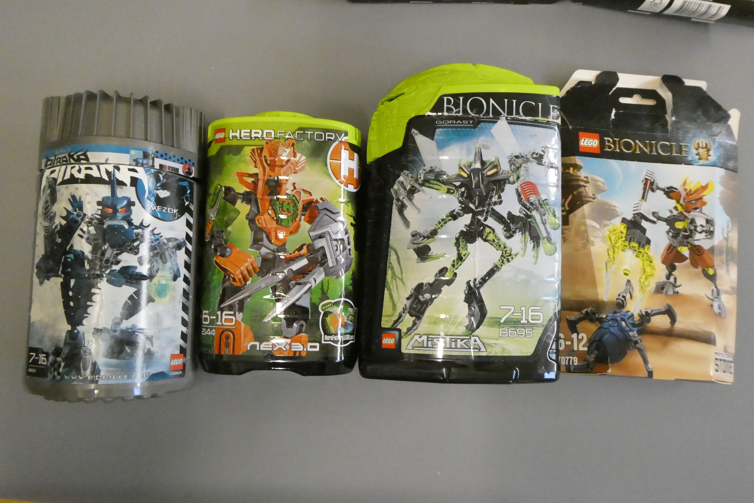 A collection of 12x boxed Lego Bionicle sets including Glatorian Legends examples Image