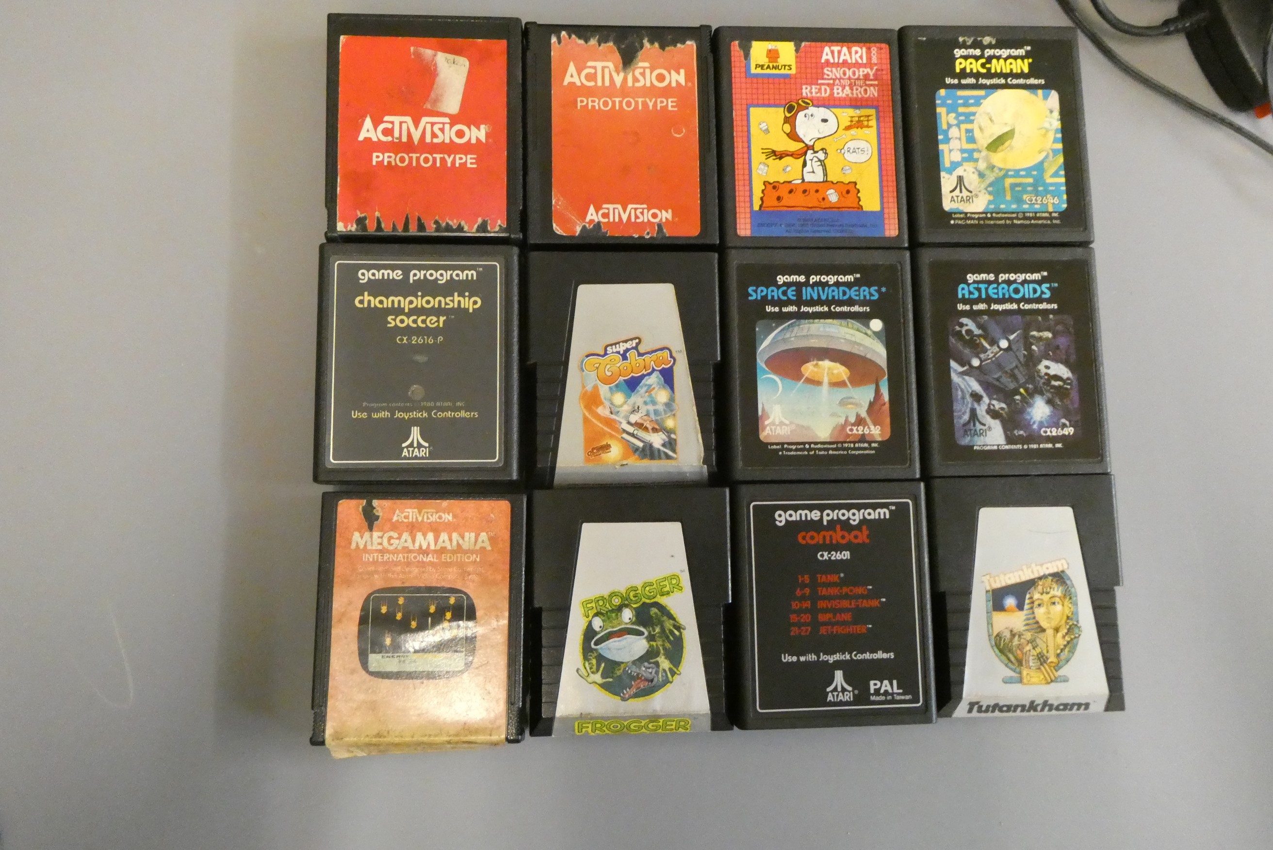 Atari video computer system with two joysticks and two paddles, together with twelve Atari Image