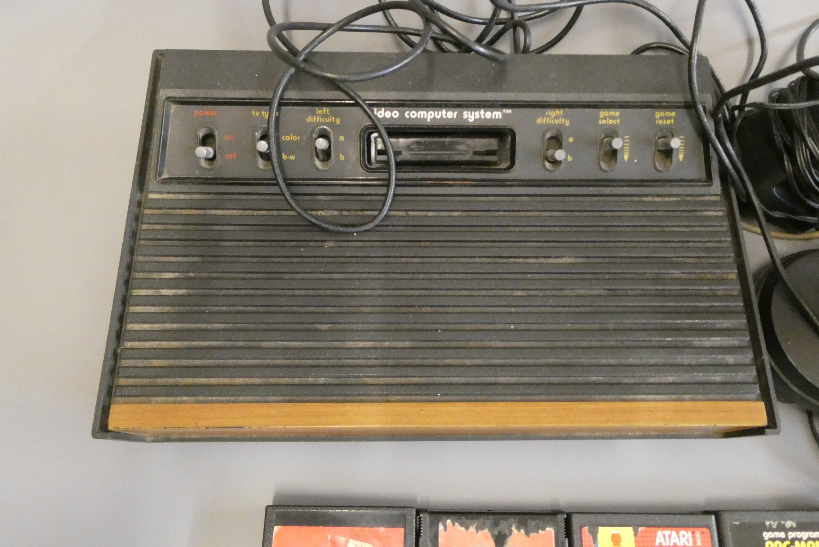 Atari video computer system with two joysticks and two paddles, together with twelve Atari Image