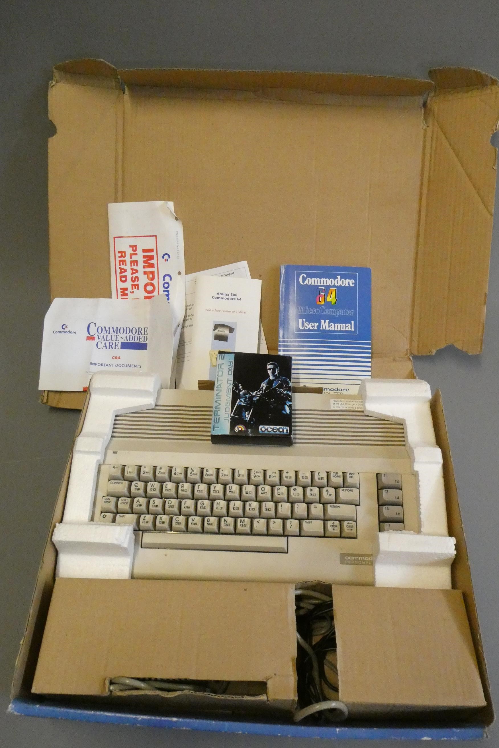 A boxed Commodore C64 'Terminator 2 Judgement Day' computer with game and instruction manuals, Image