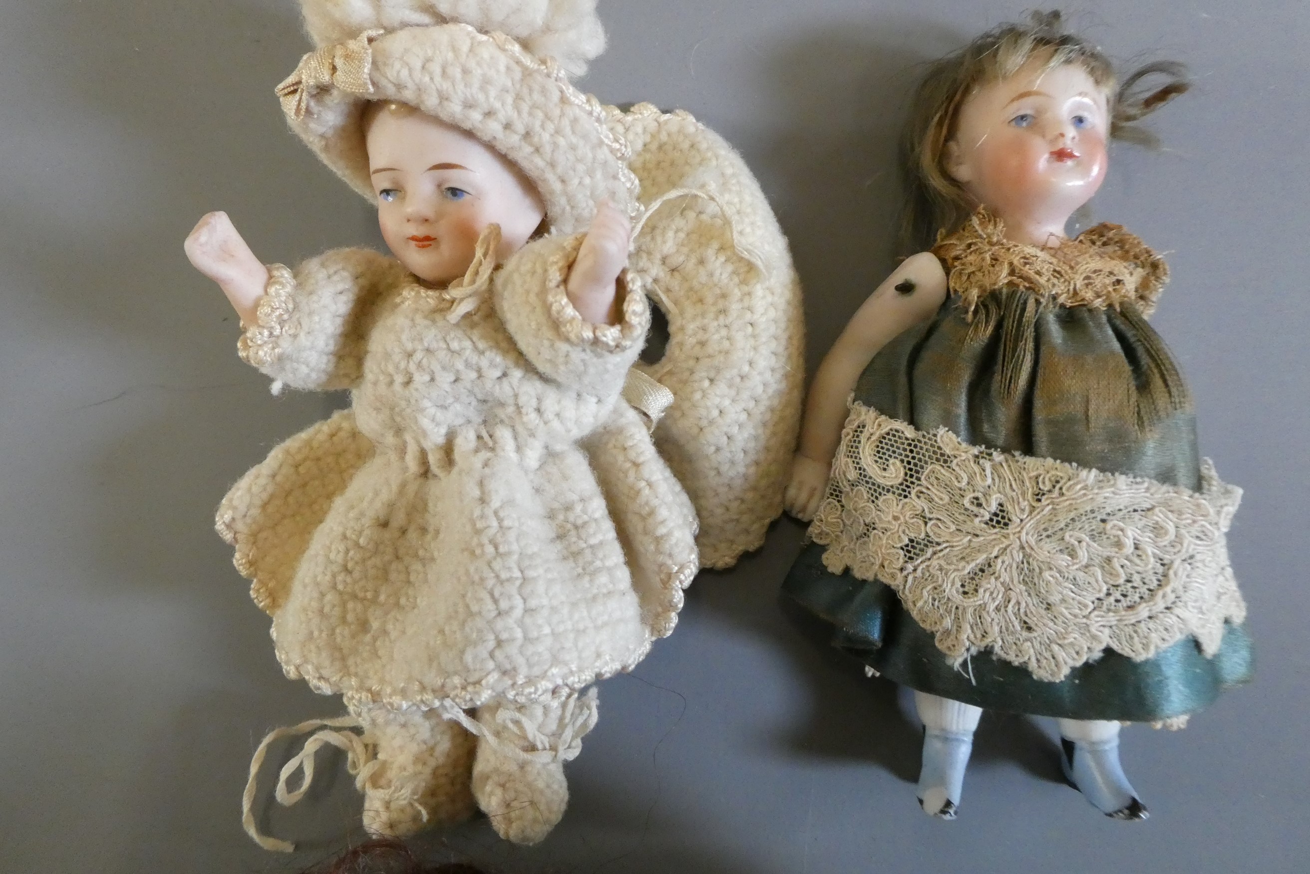 Four all bisque doll's house dolls Image