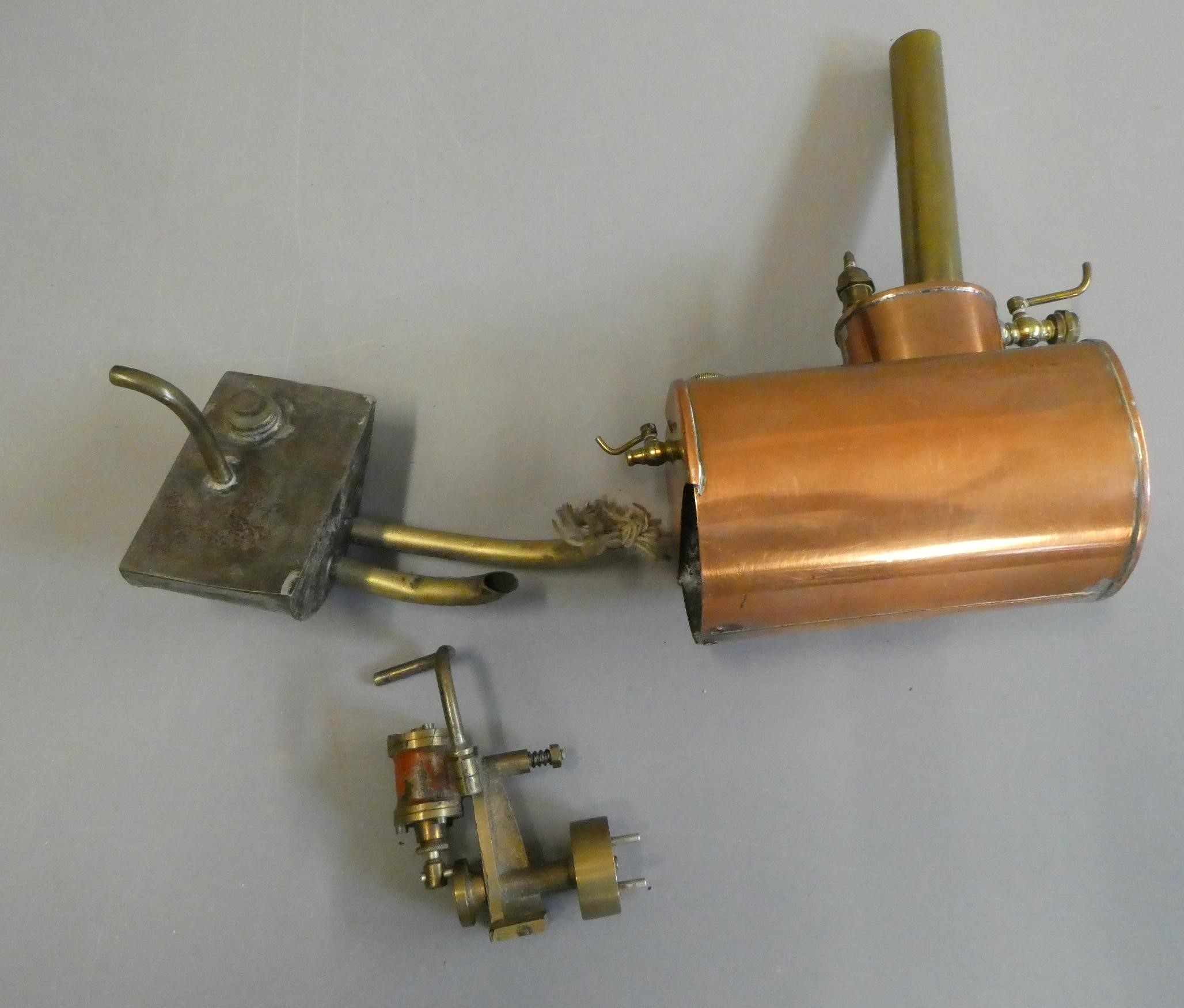 A wooden model steam launch with single cylinder oscillating steam engine boiler and spirit burner Image