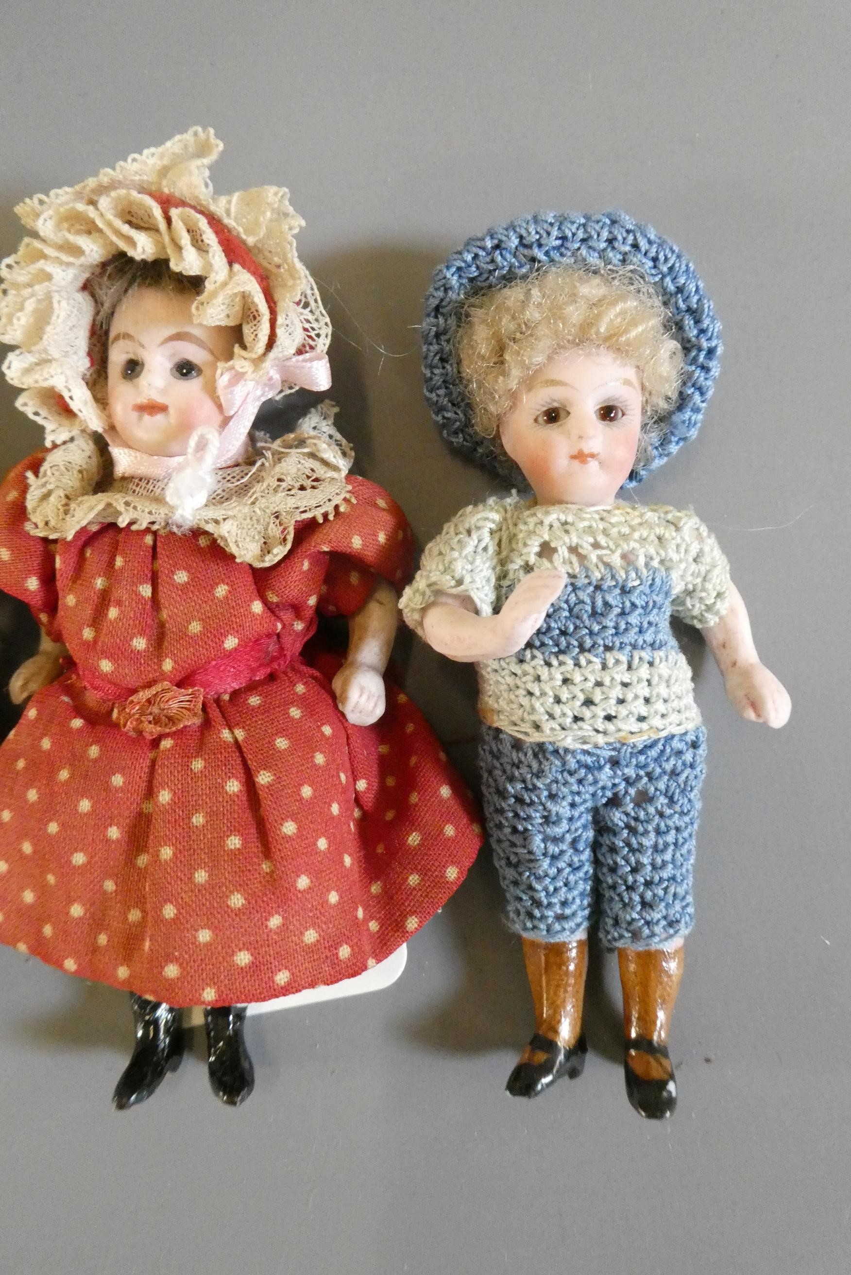 Three all bisque doll's house dolls Image