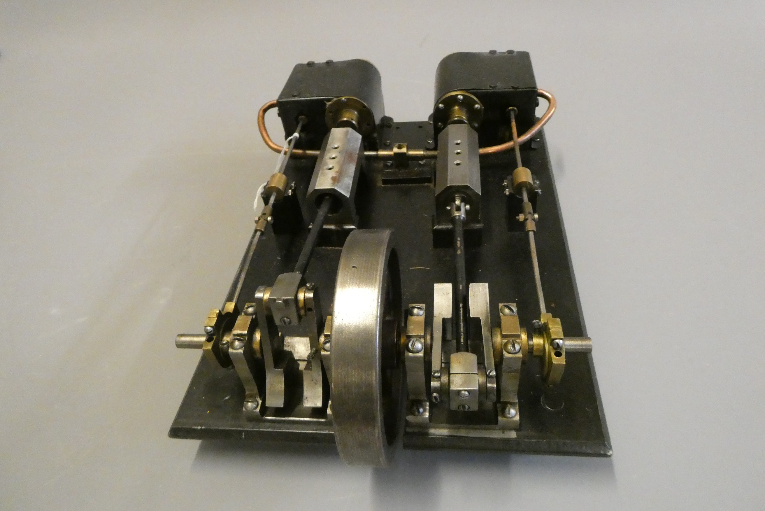 Large twin cylinder horizontal steam engine constructed from steel fabrications with cast fly wheel, Image