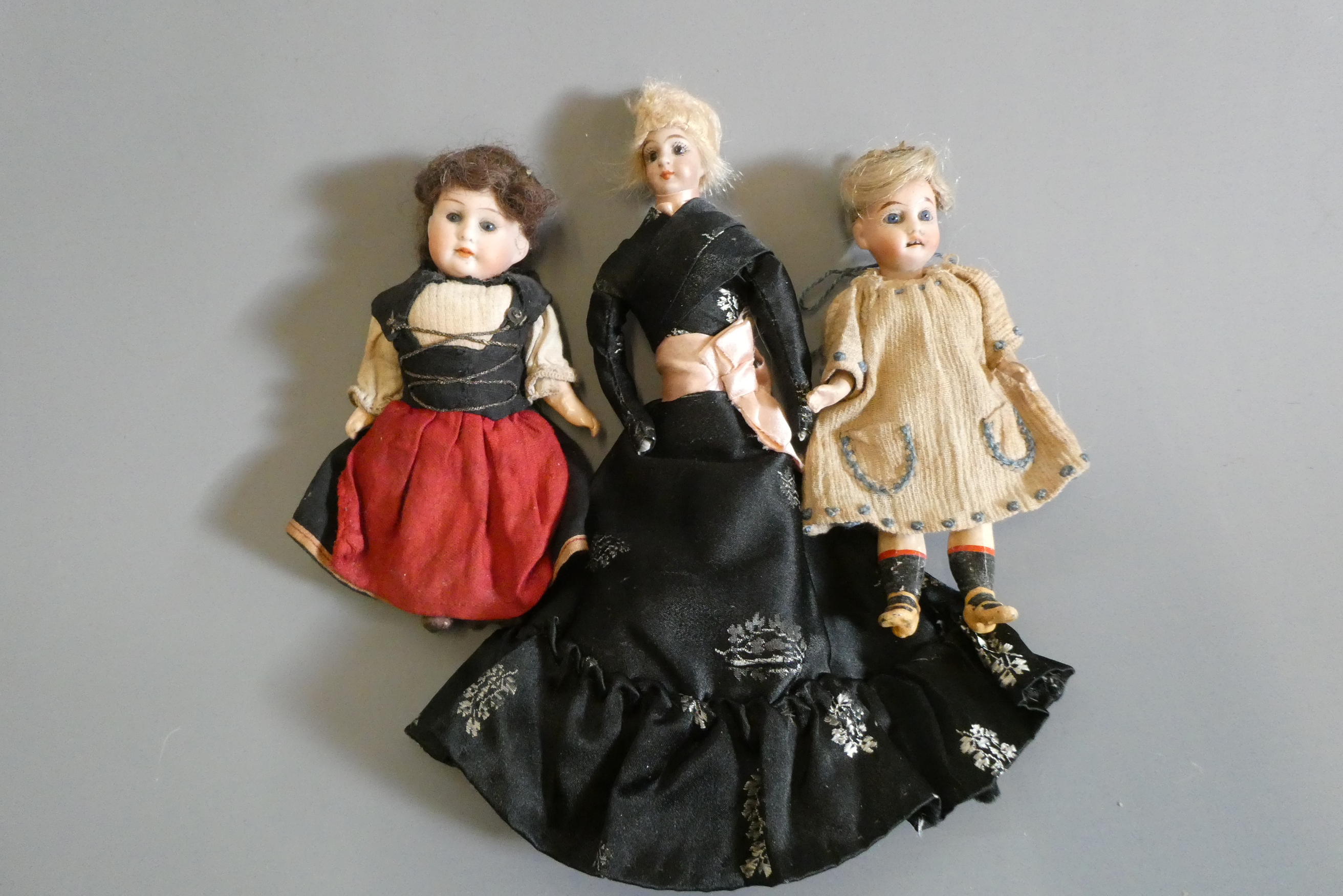 Three doll's house dolls Image