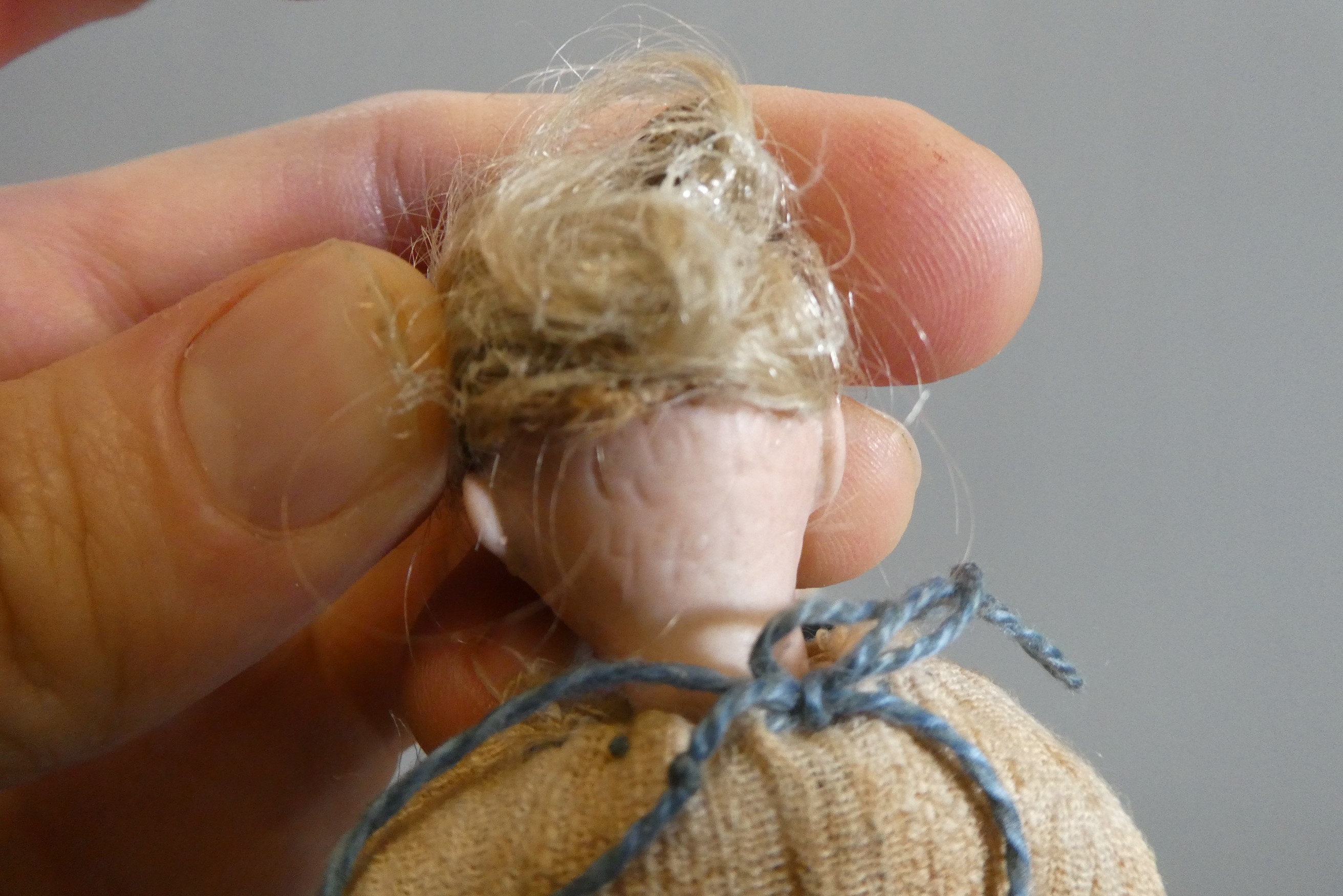 Three doll's house dolls Image