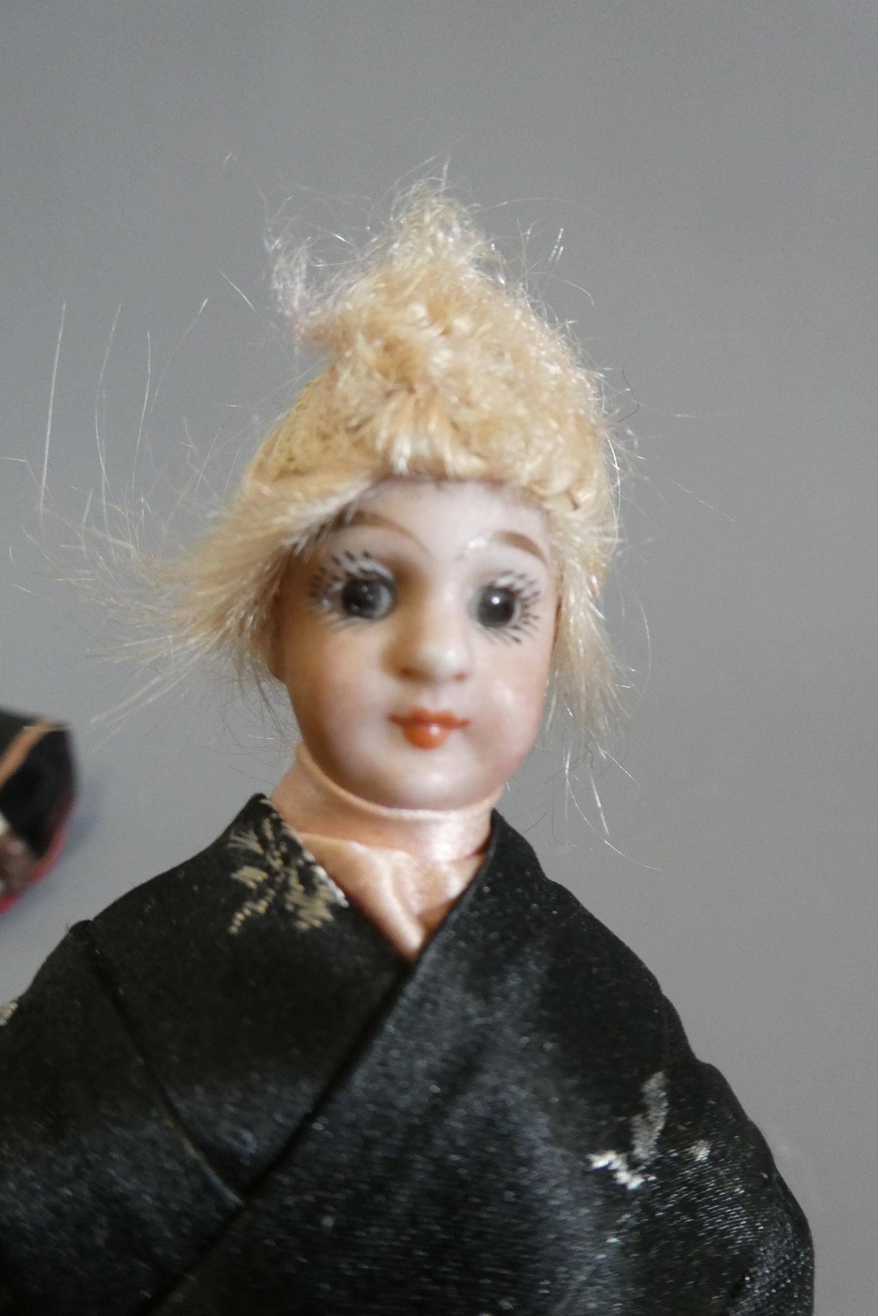 Three doll's house dolls Image