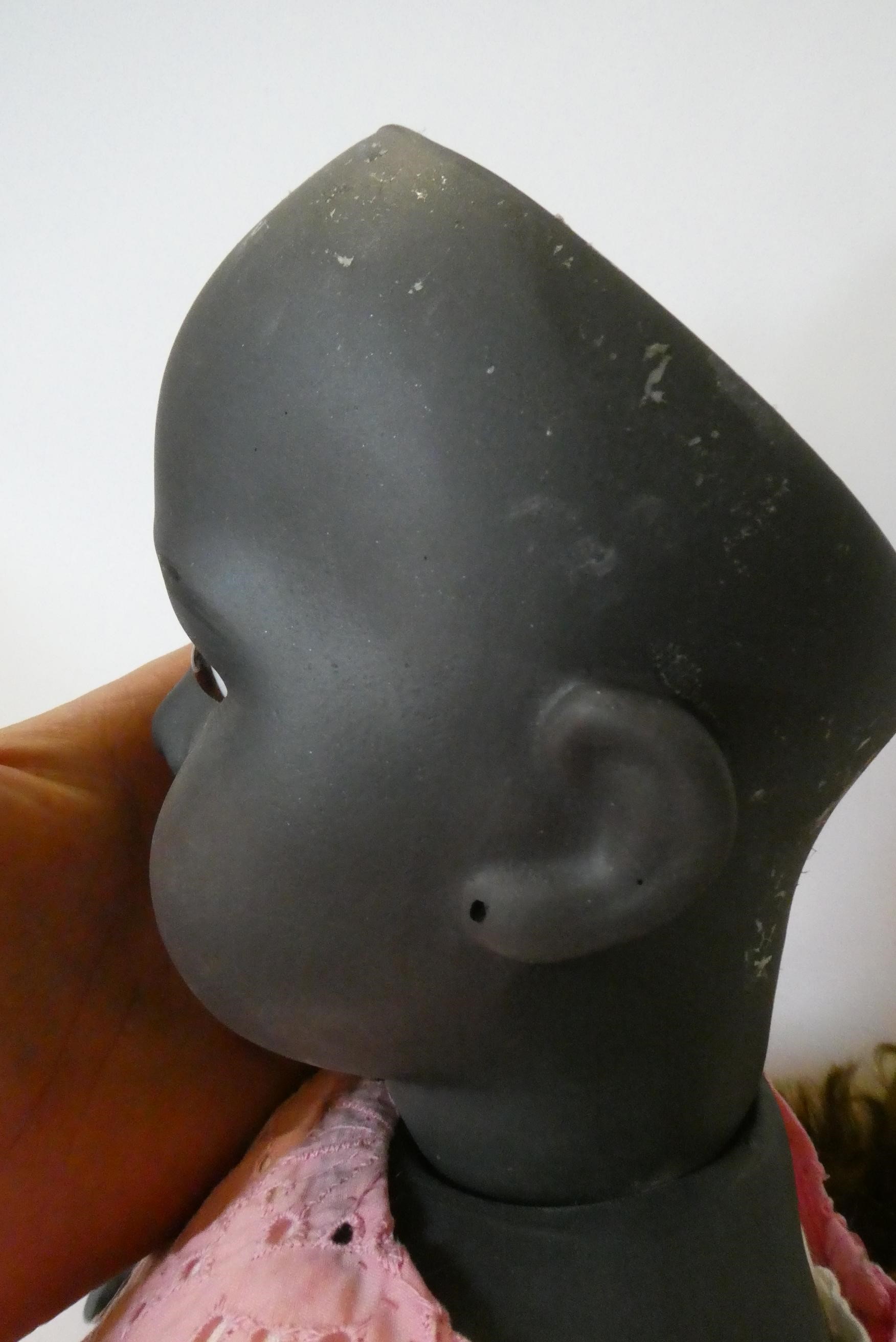 A reproduction Bru bisque socket shoulder head girl doll with brown glass fixed eyes Image