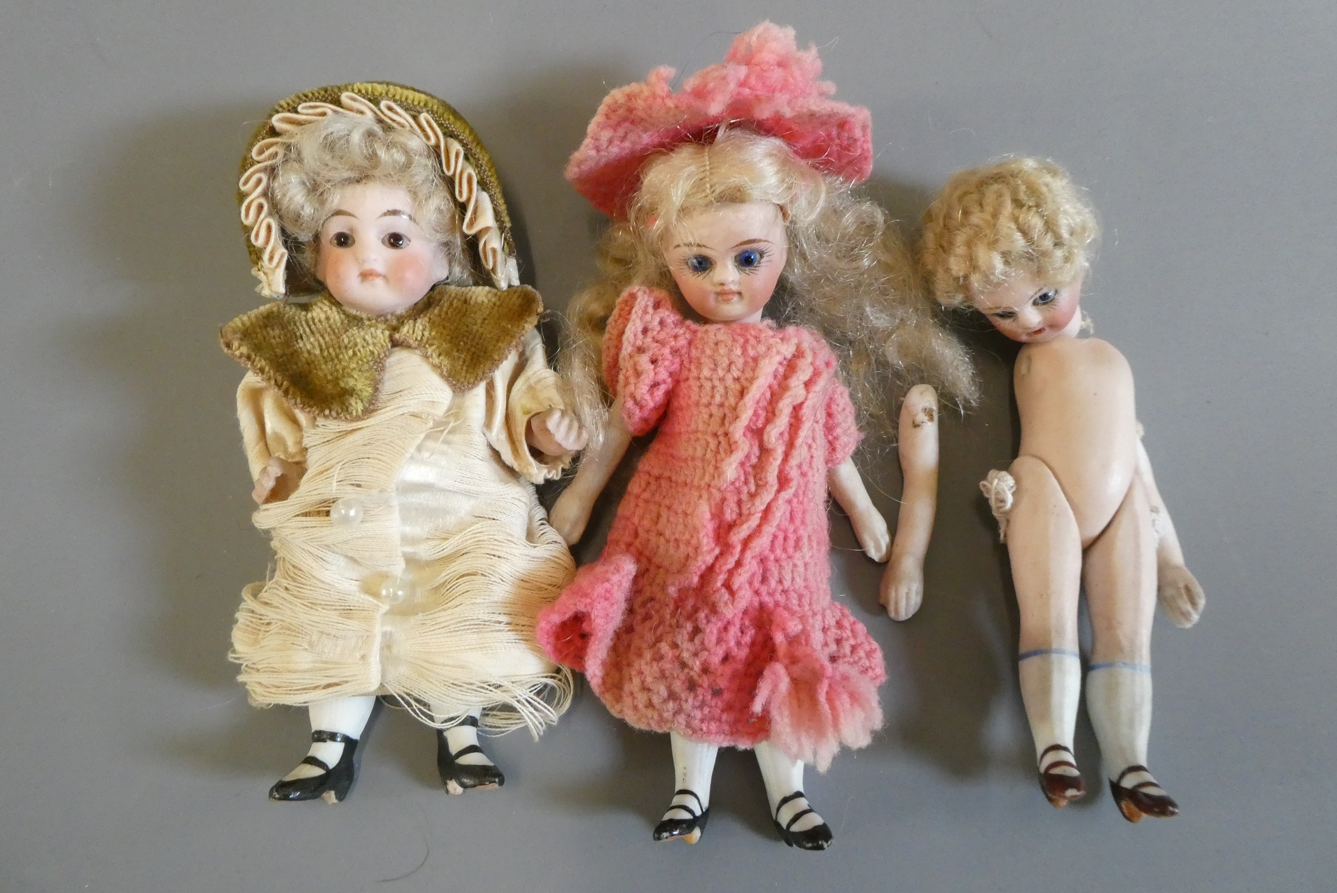 Three all bisque doll's house dolls Image