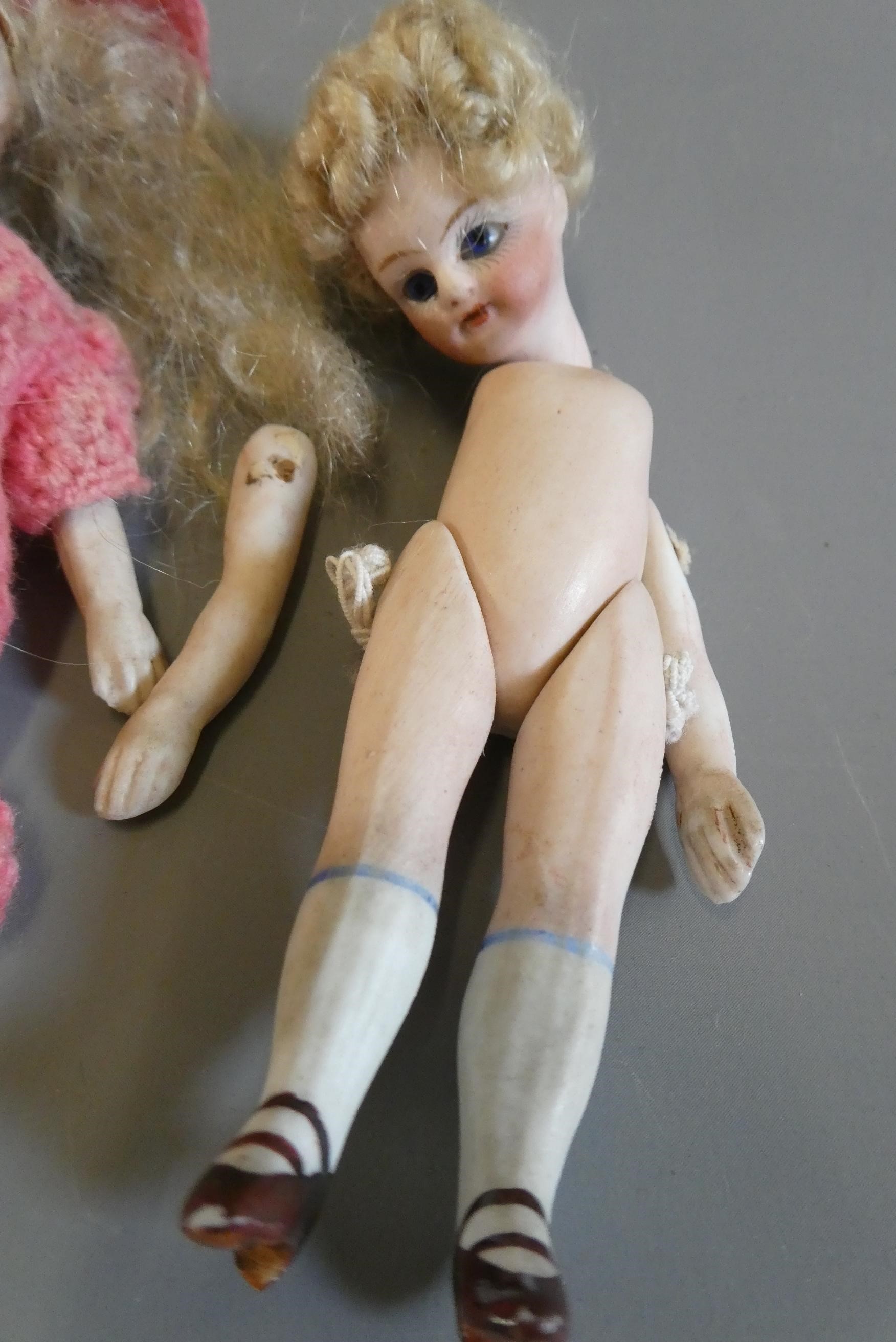 Three all bisque doll's house dolls Image