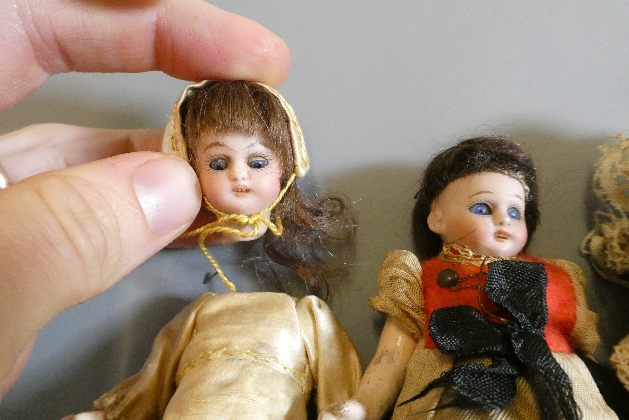 Three bisque socket head doll's house dolls Image