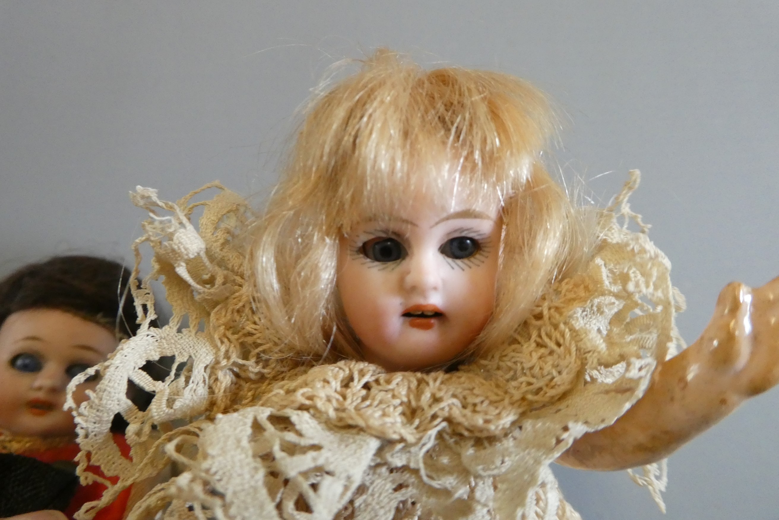 Three bisque socket head doll's house dolls Image
