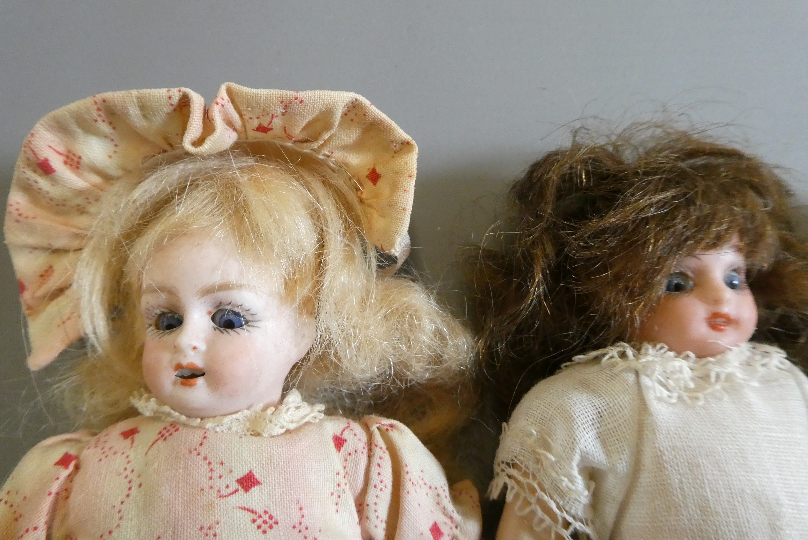 Three bisque socket head doll's house dolls Image