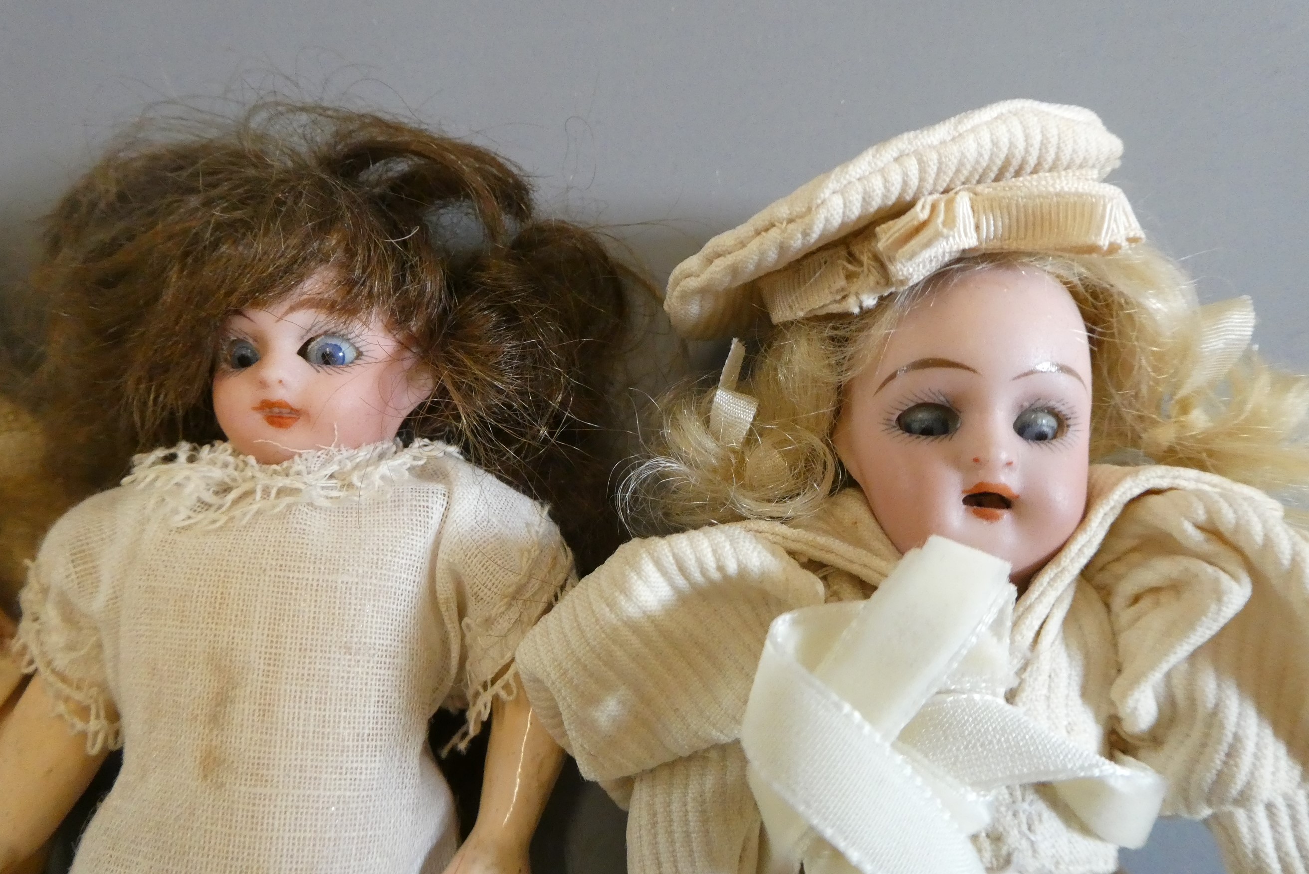 Three bisque socket head doll's house dolls Image