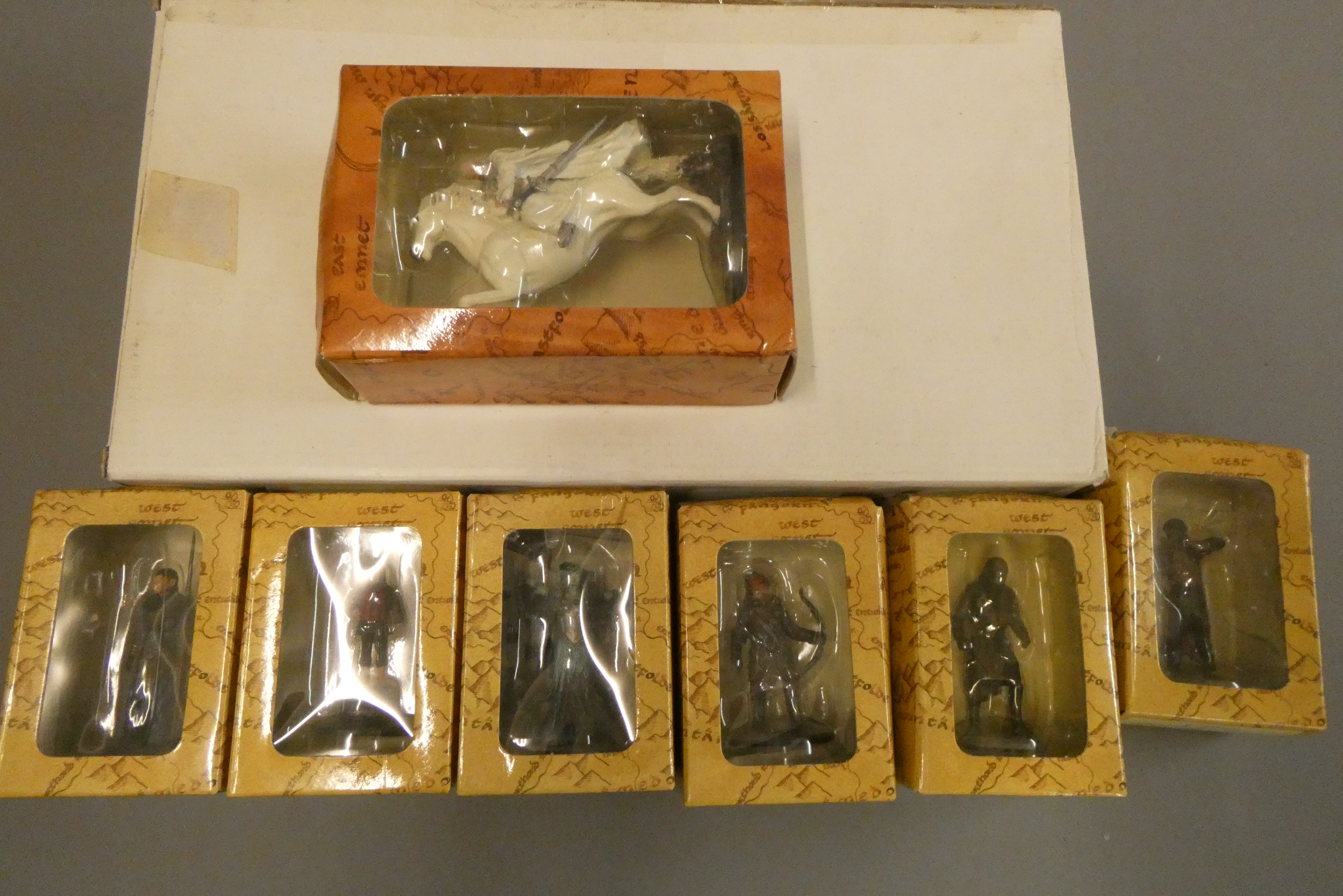 Seven New Line Cinema collectables Lord of the Rings figures and display stand, all items boxed, Image