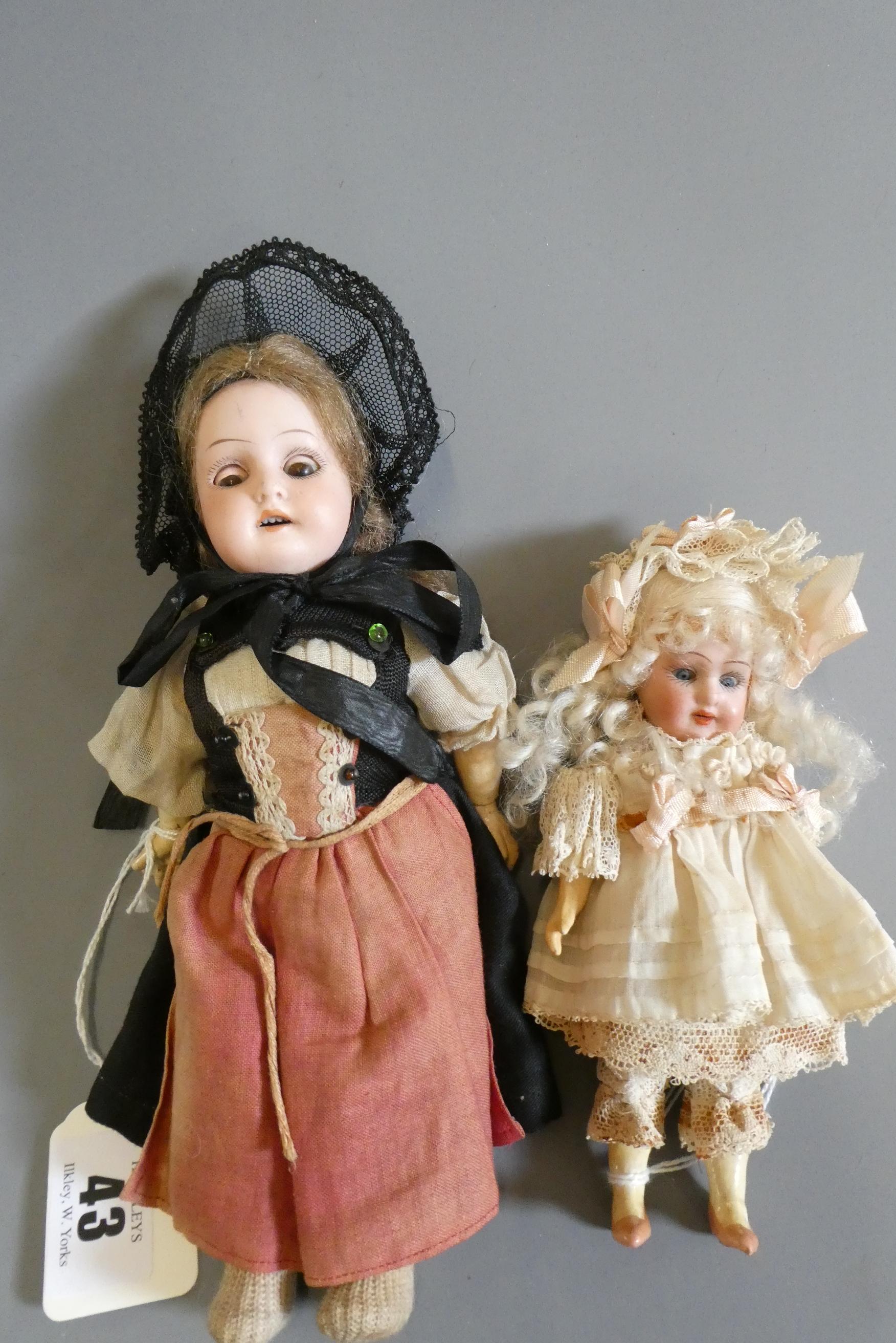 Two small Armand Marseille bisque socket head dolls Image