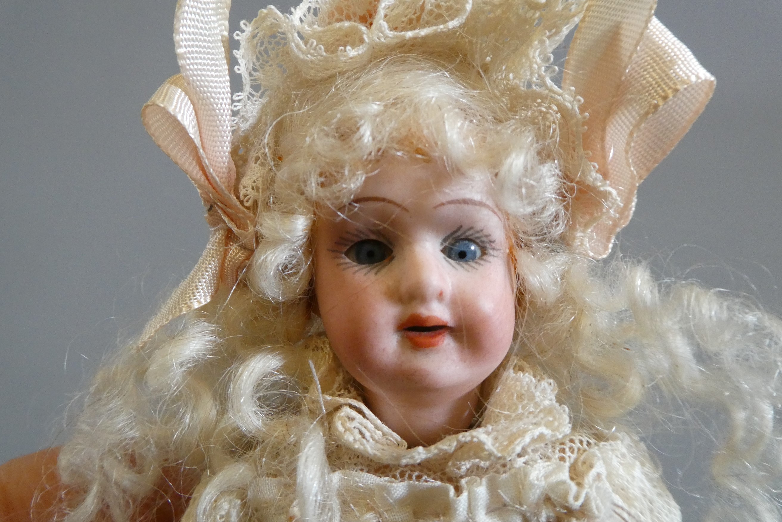 Two small Armand Marseille bisque socket head dolls Image