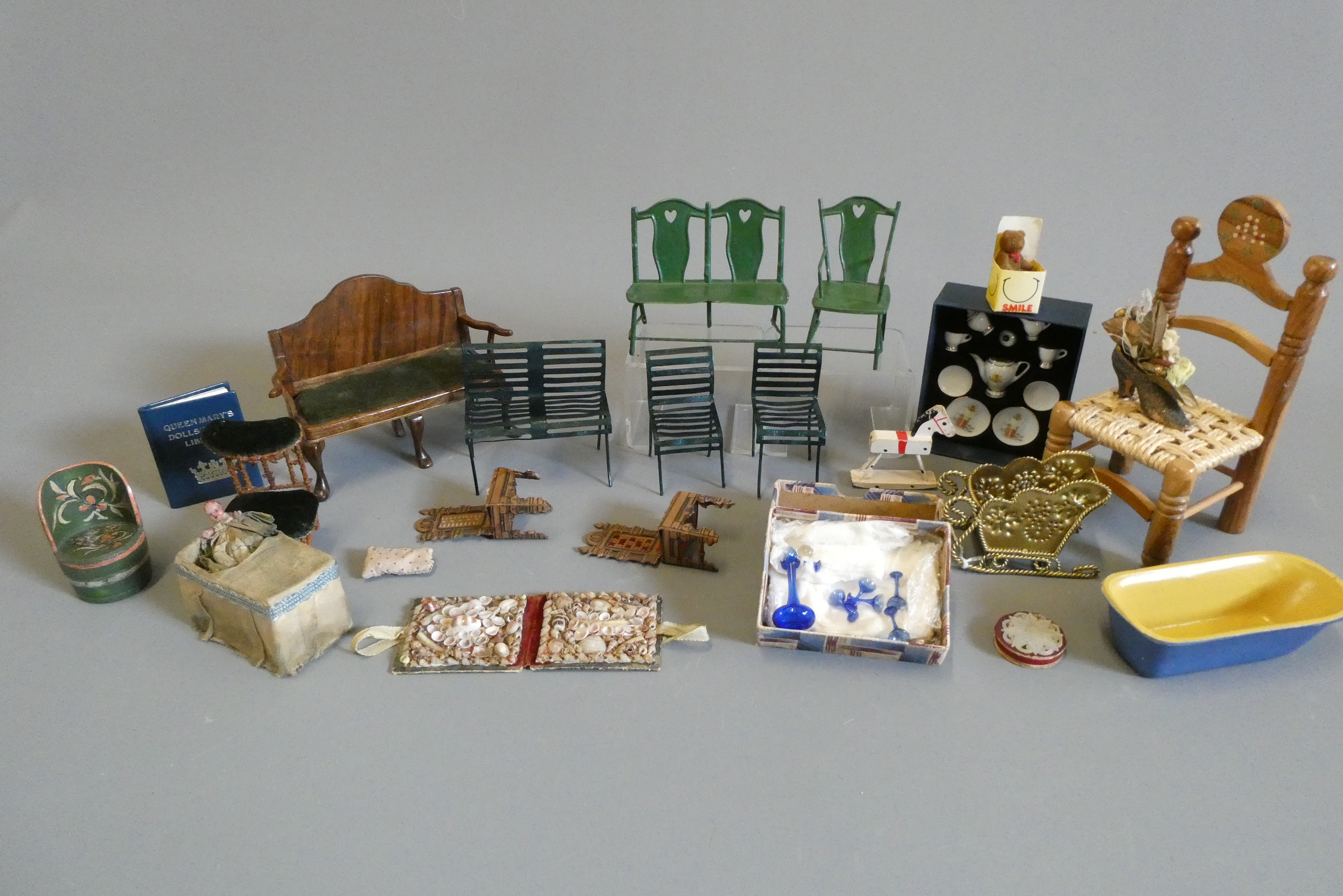 A box of vintage doll's house furniture and accessories Image