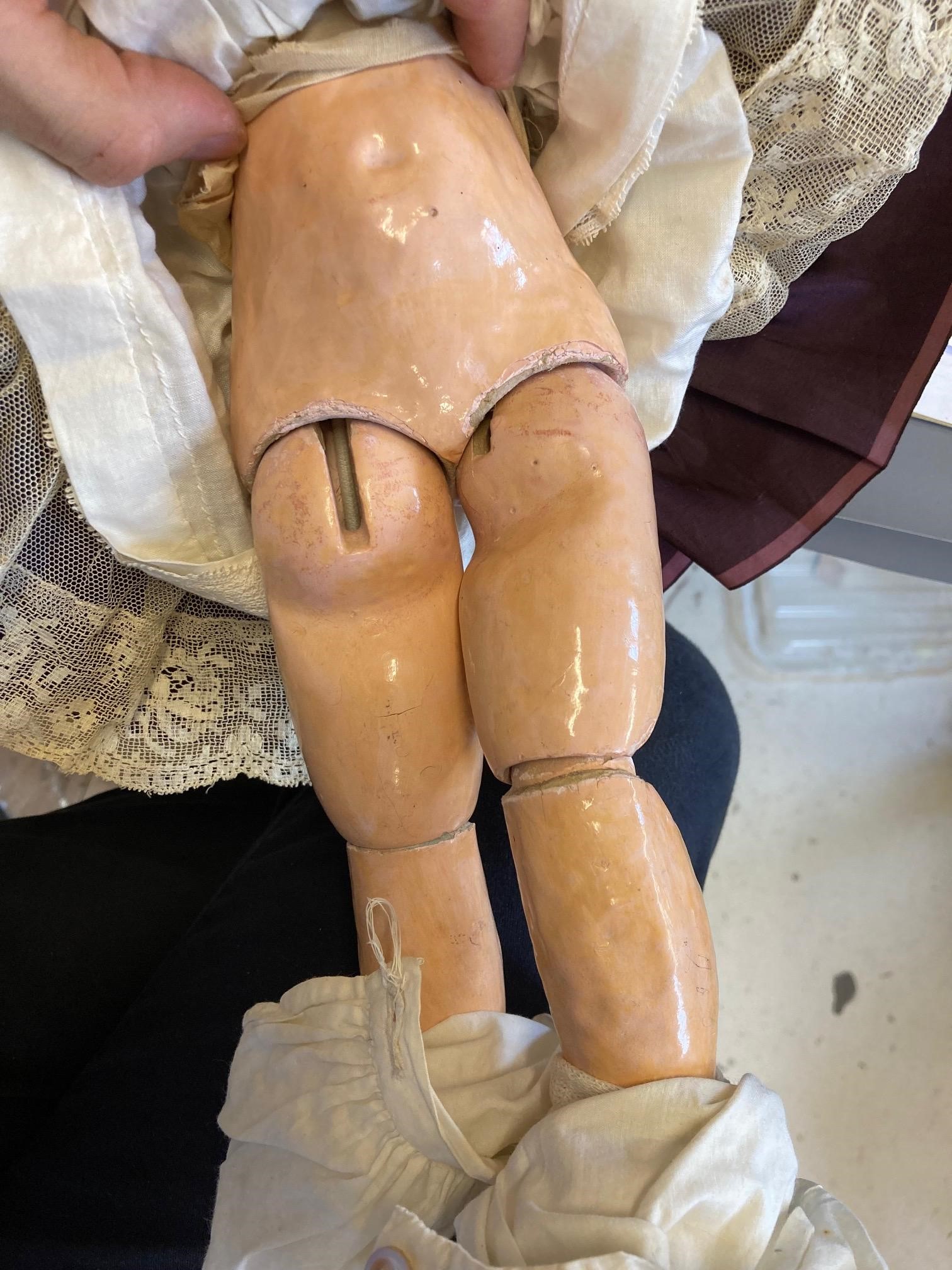 A Tete Jumeau bisque socket head doll with blue glass fixed eyes Image