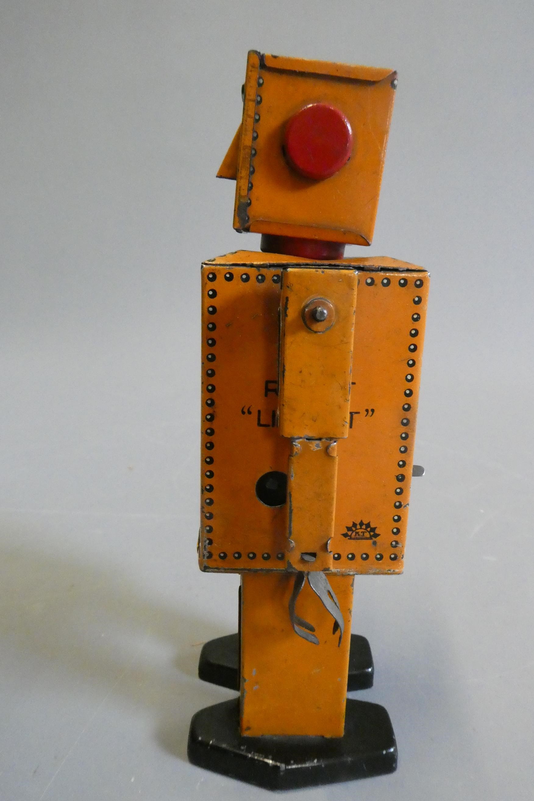Rare KT toys Japan clockwork robot "Liliput" NP5357 finished in orange with printed detail. Tested Image