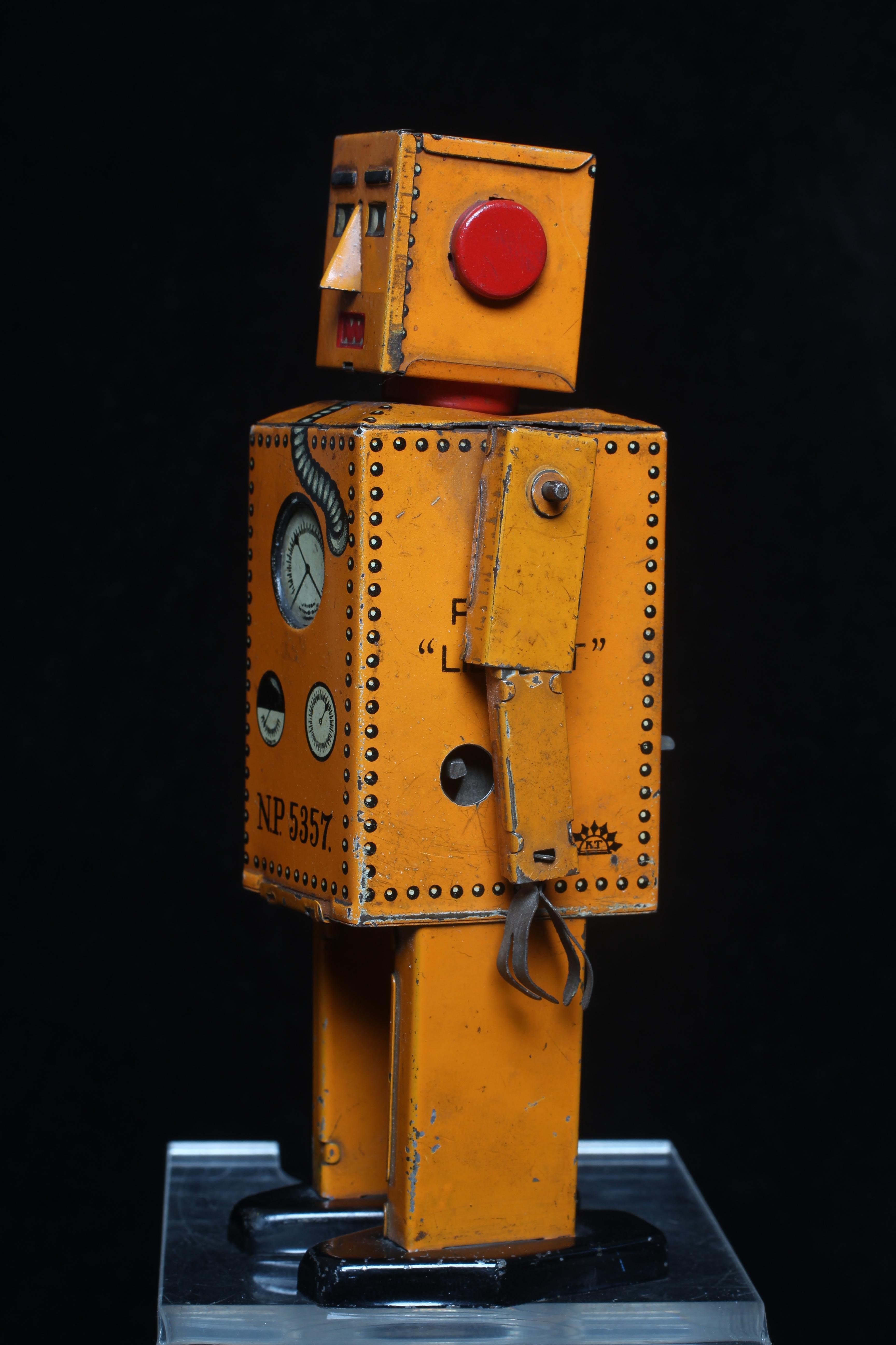Rare KT toys Japan clockwork robot "Liliput" NP5357 finished in orange with printed detail. Tested Image