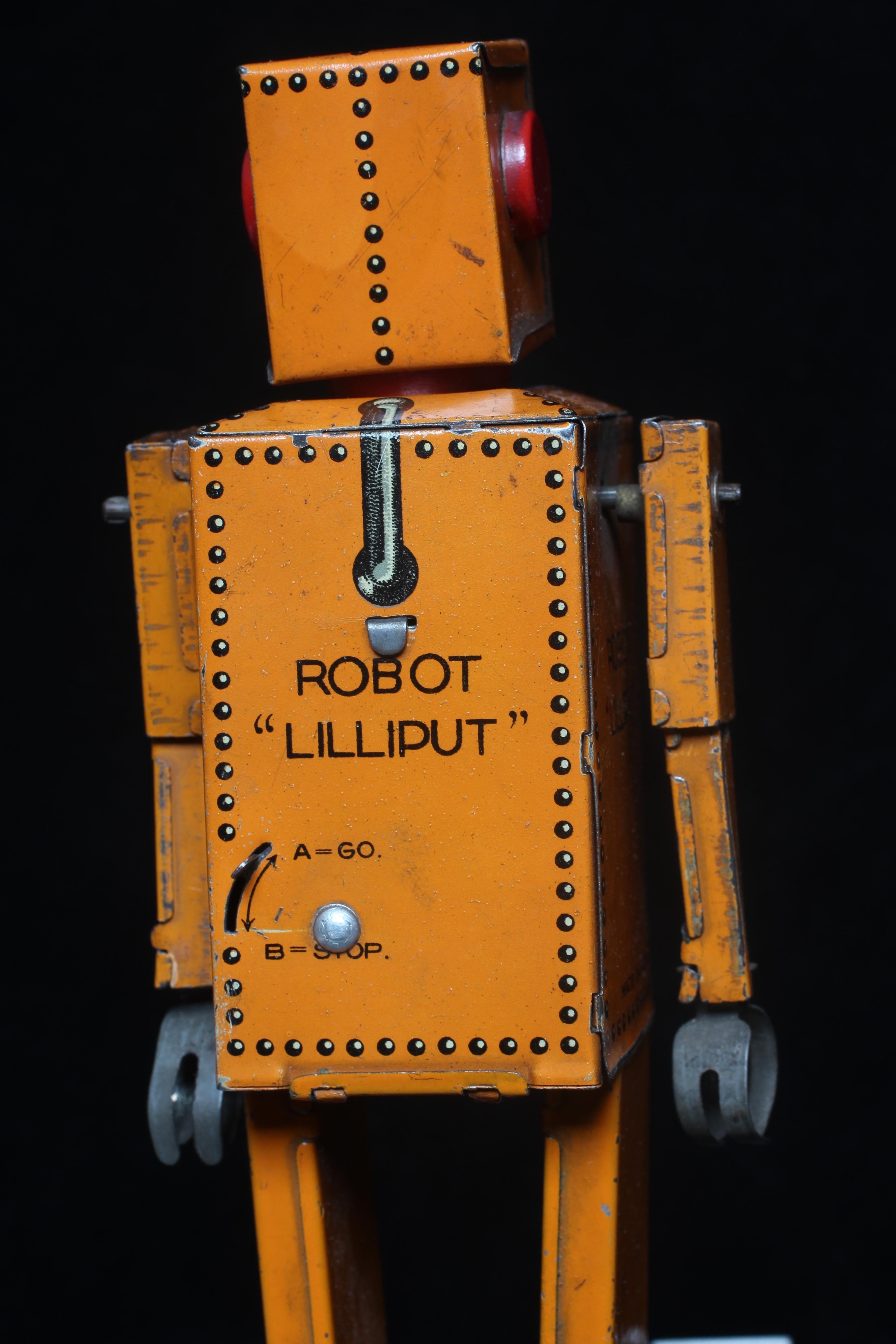 Rare KT toys Japan clockwork robot "Liliput" NP5357 finished in orange with printed detail. Tested Image