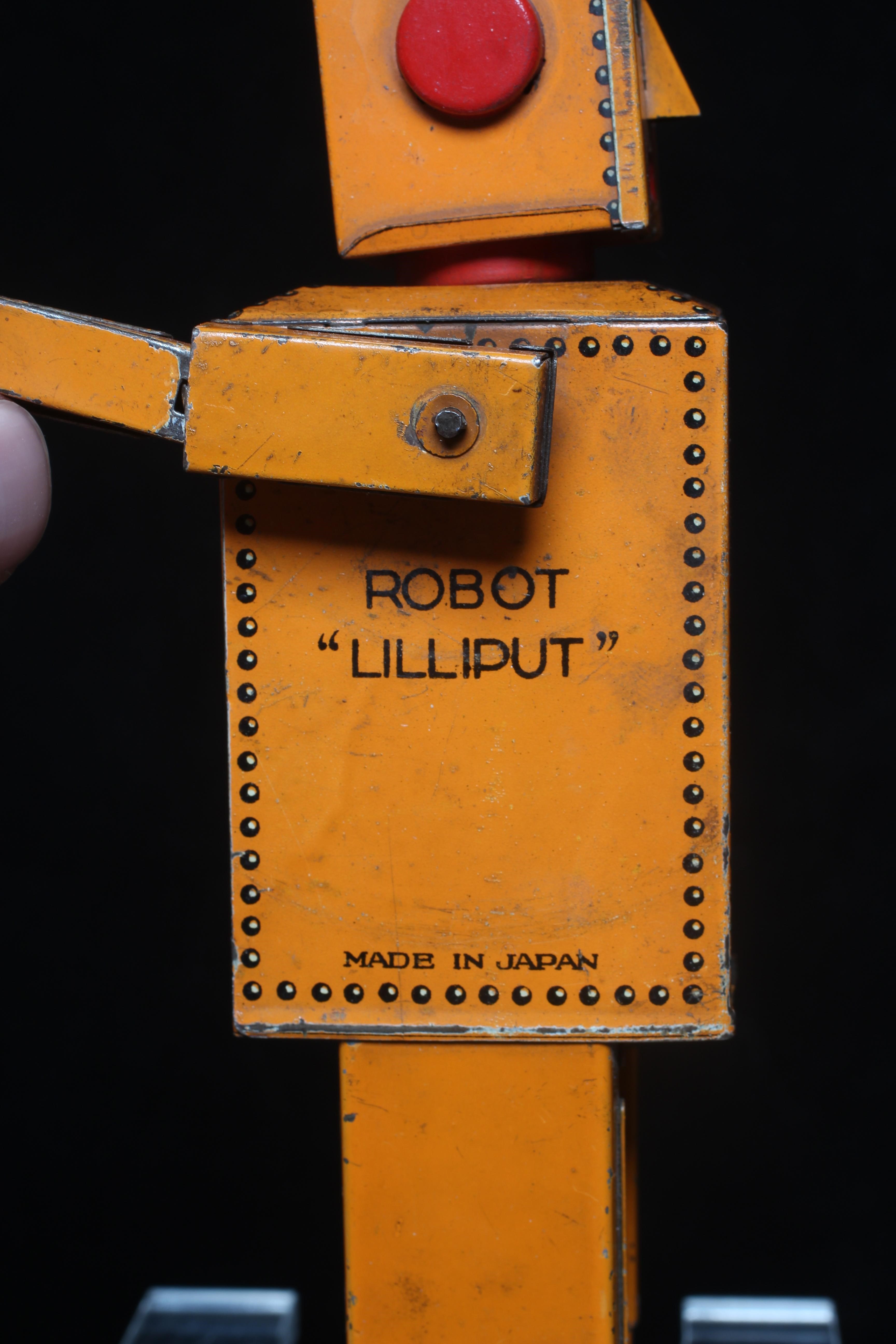 Rare KT toys Japan clockwork robot "Liliput" NP5357 finished in orange with printed detail. Tested Image