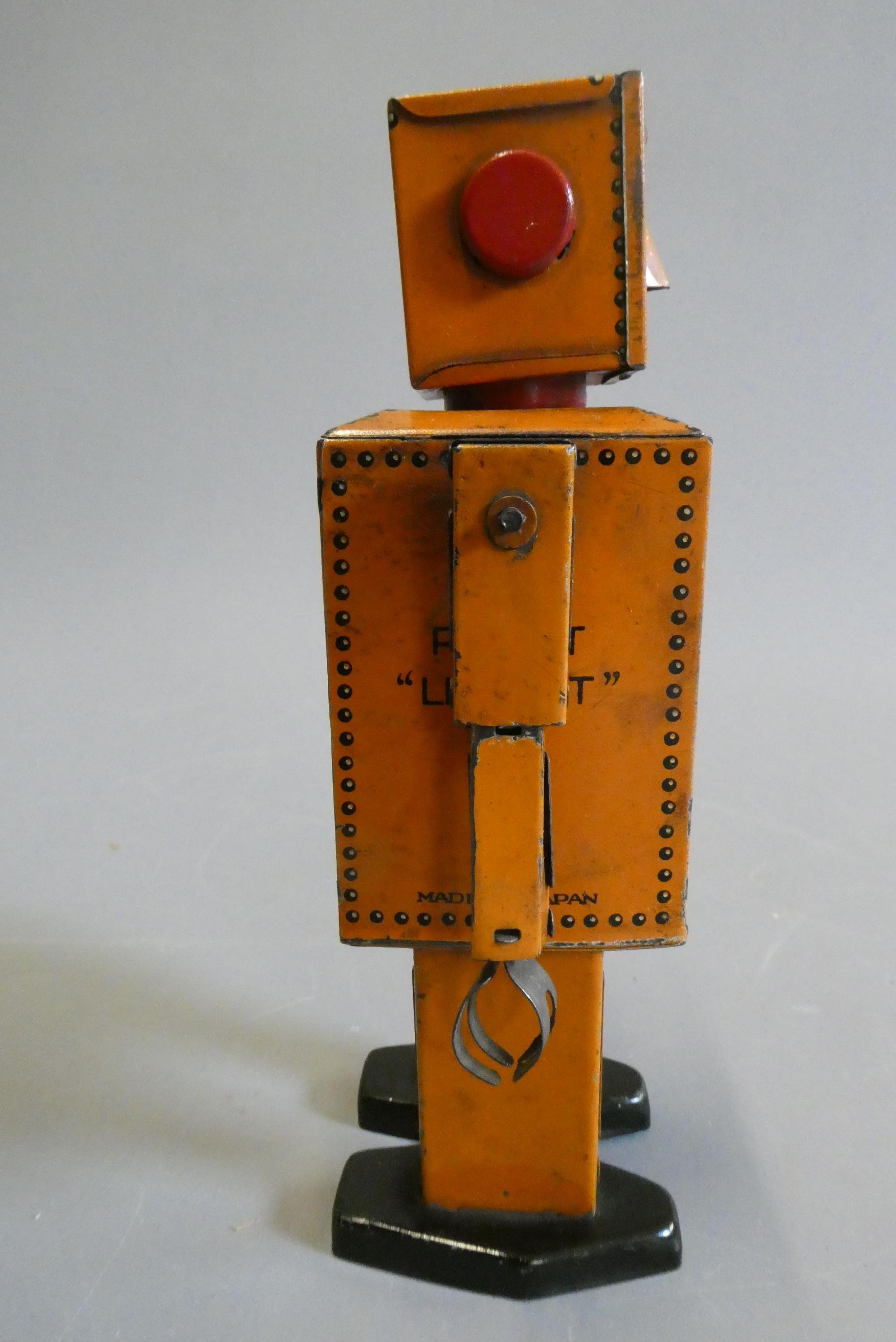 Rare KT toys Japan clockwork robot "Liliput" NP5357 finished in orange with printed detail. Tested Image