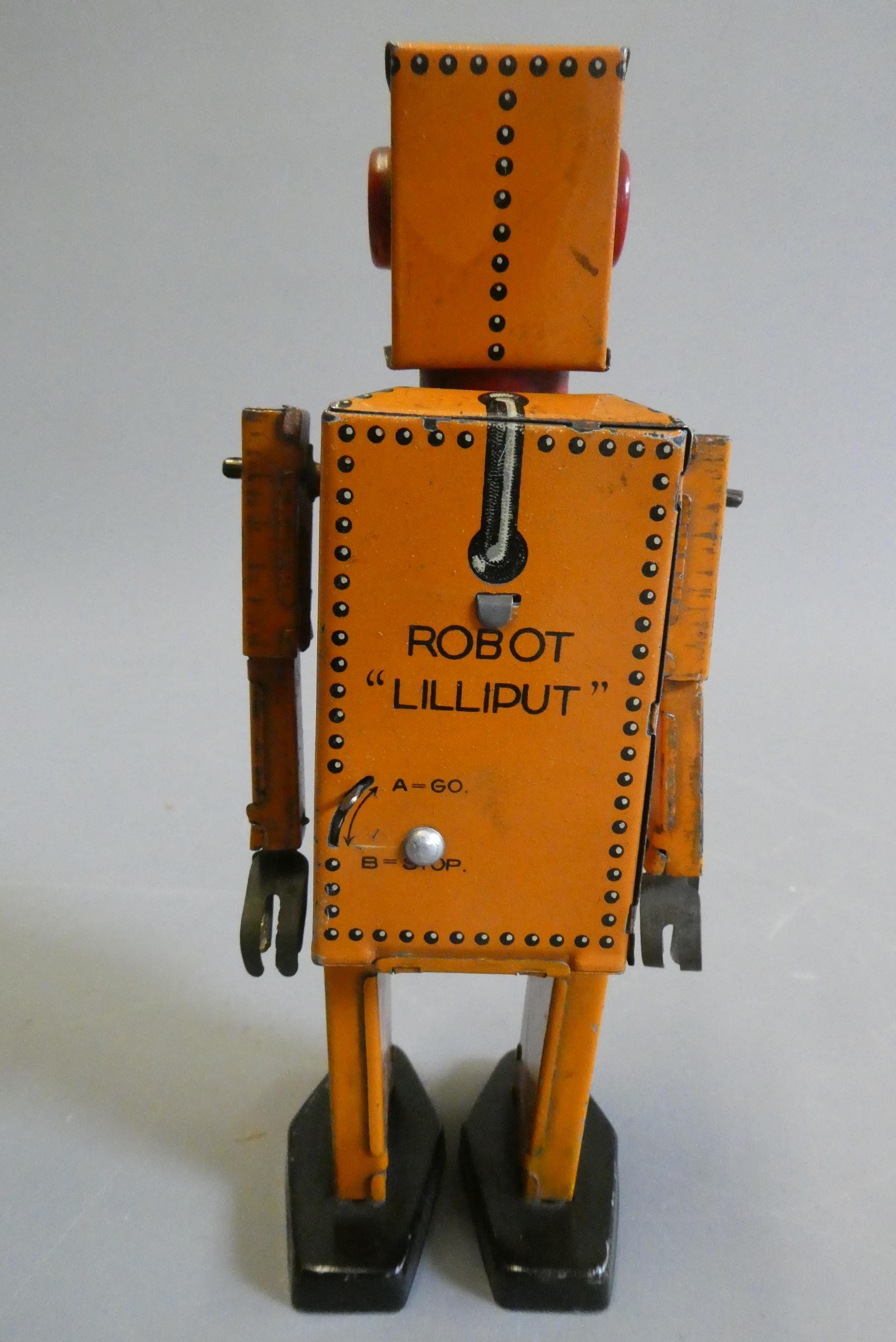 Rare KT toys Japan clockwork robot "Liliput" NP5357 finished in orange with printed detail. Tested Image