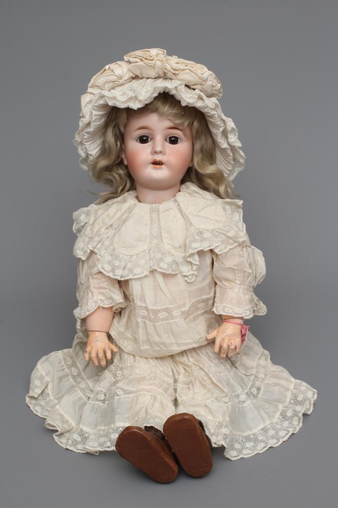 A rare French "Mon Tresor" bisque socket head doll with brown glass fixed eyes Image